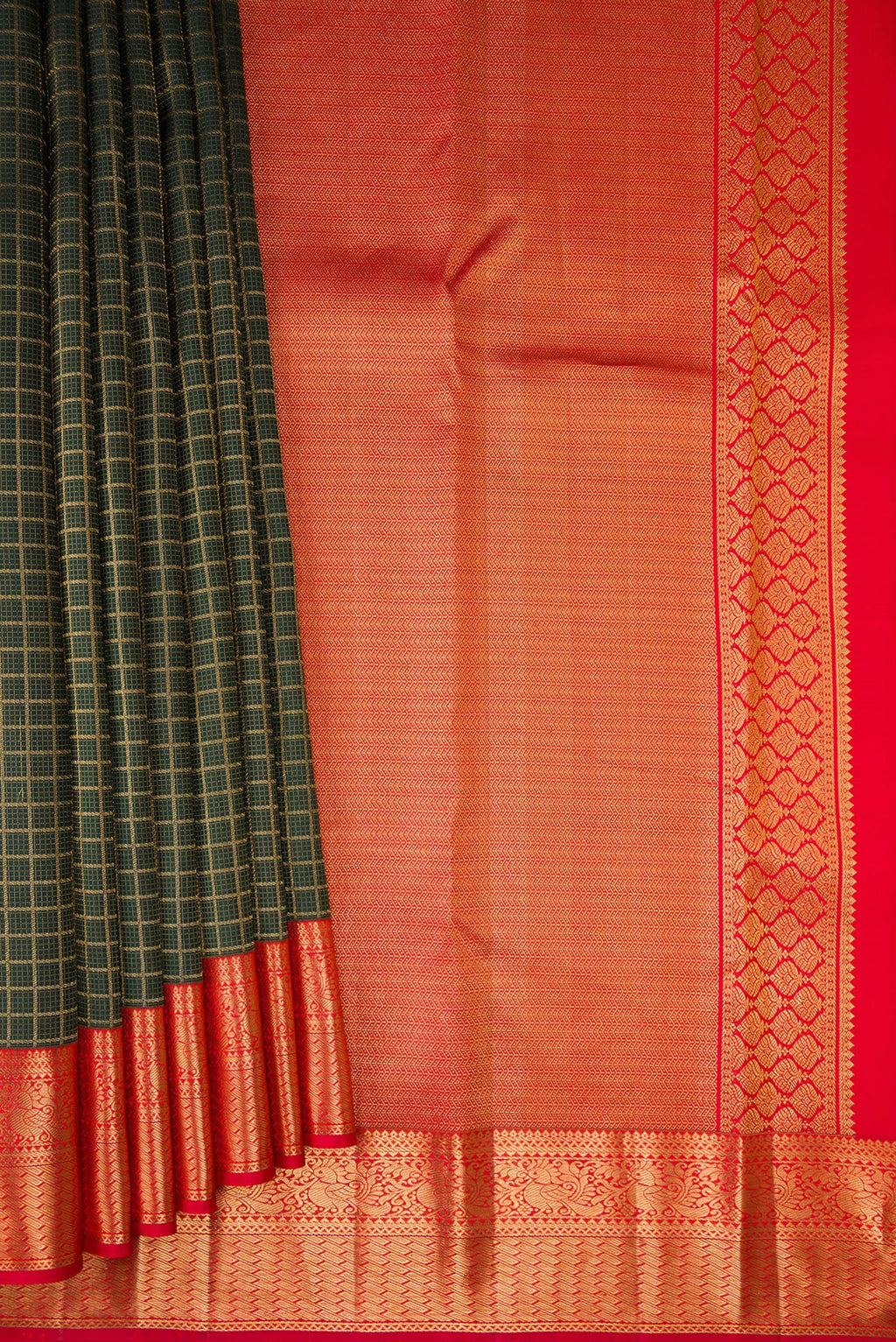 Pleats and pallu of Pure Silk Bottle Green Kanjivaram Saree with Checked design on the body and Zari Border. 