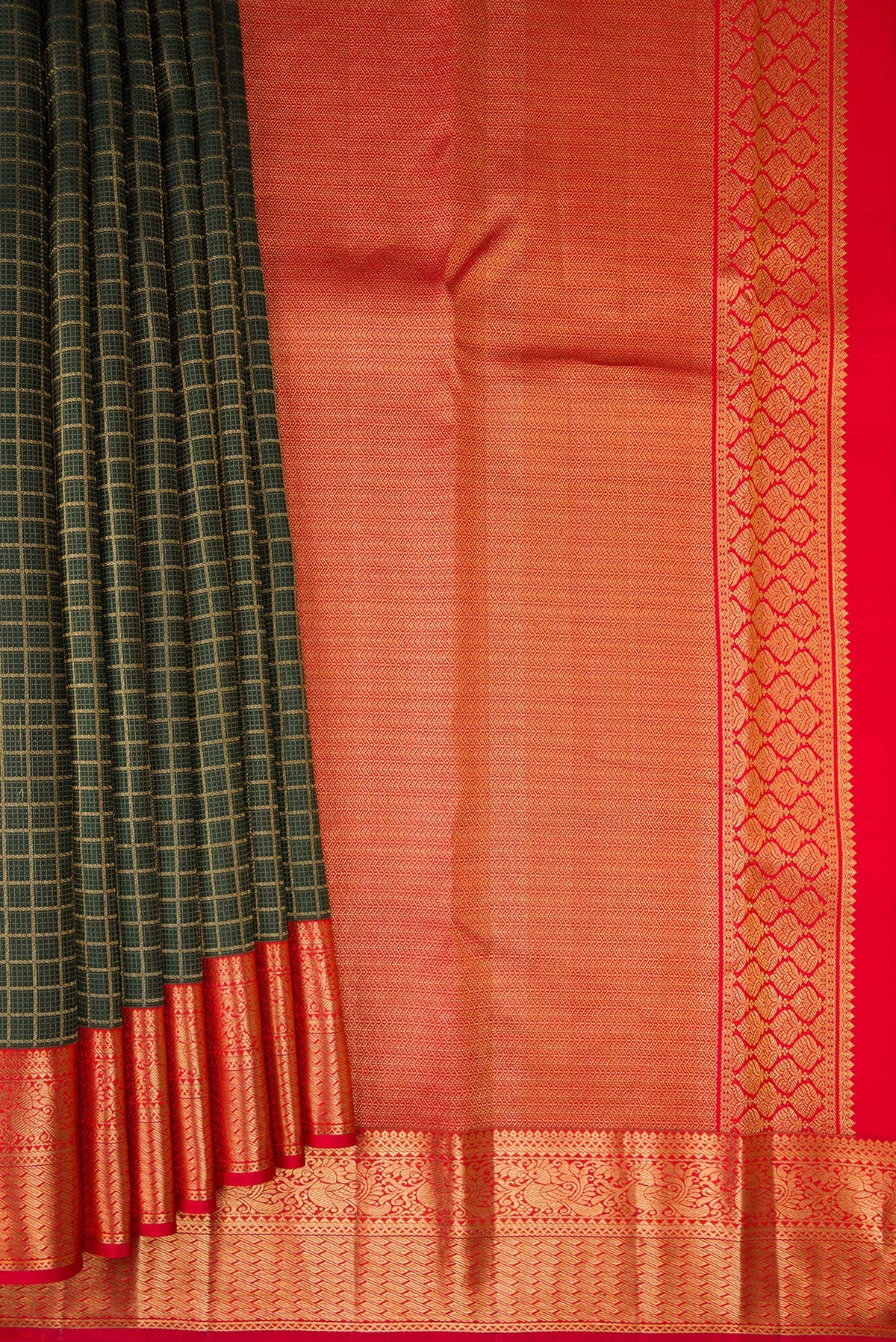 Pleats and pallu of Pure Silk Bottle Green Kanjivaram Saree with Checked design on the body and Zari Border. 