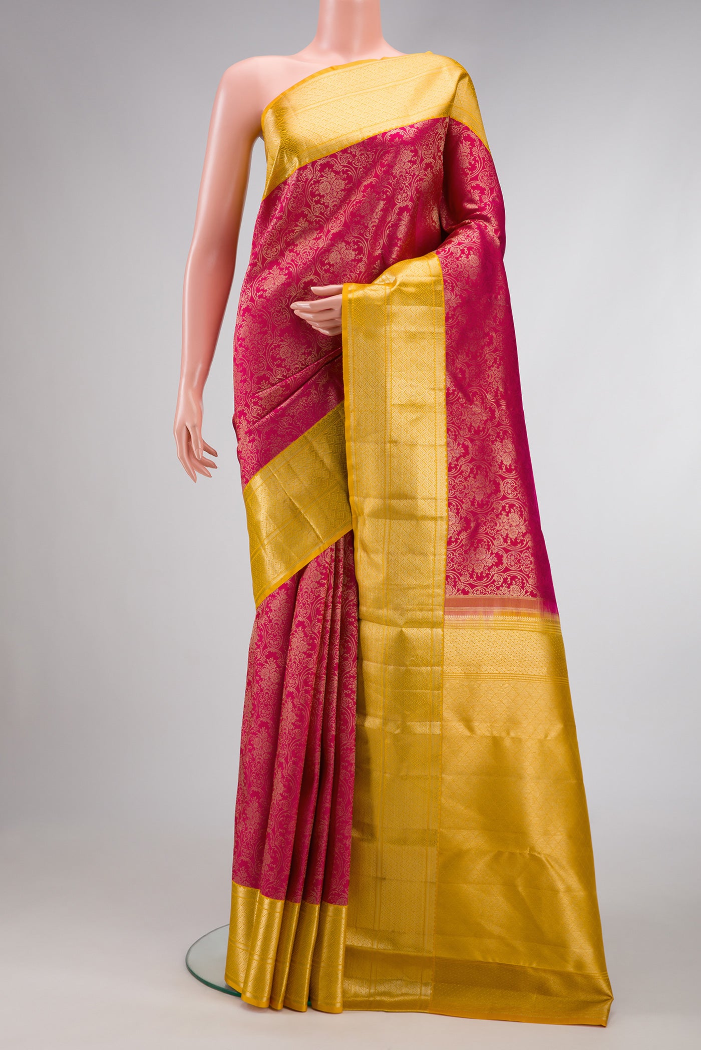 Pink Dual Tone Kanjivaram Silk Saree with Zari Brocade on the body and Zari Border.  displayed on a mannequin