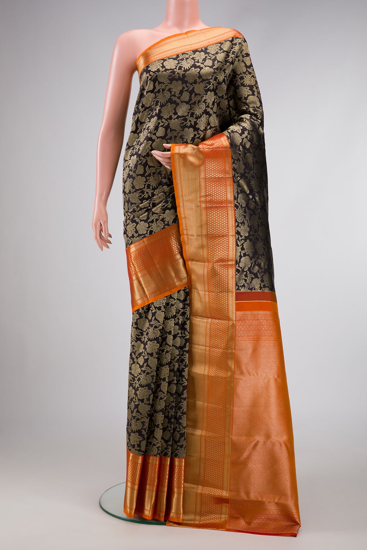 Black Dual Tone Kanjivaram Silk Saree with Zari Brocade on the body and Zari Border.  displayed on a mannequin