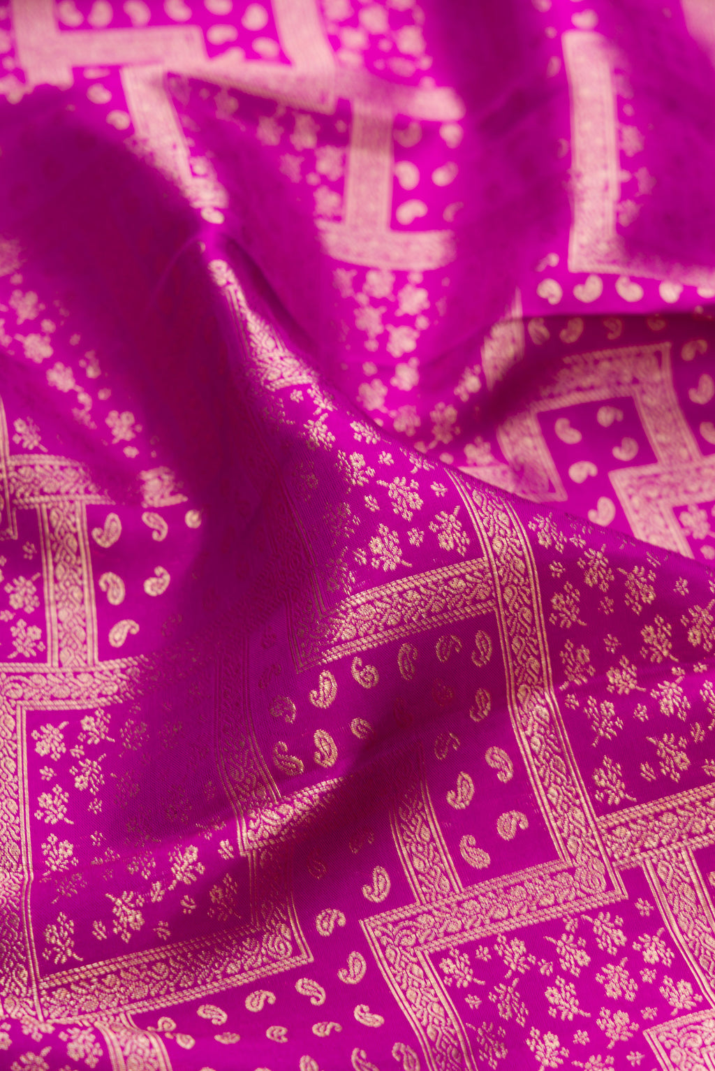 Close up of Purple Kanjivaram Silk Saree with Zari Brocade on the body and Zari Border.  displaying folds