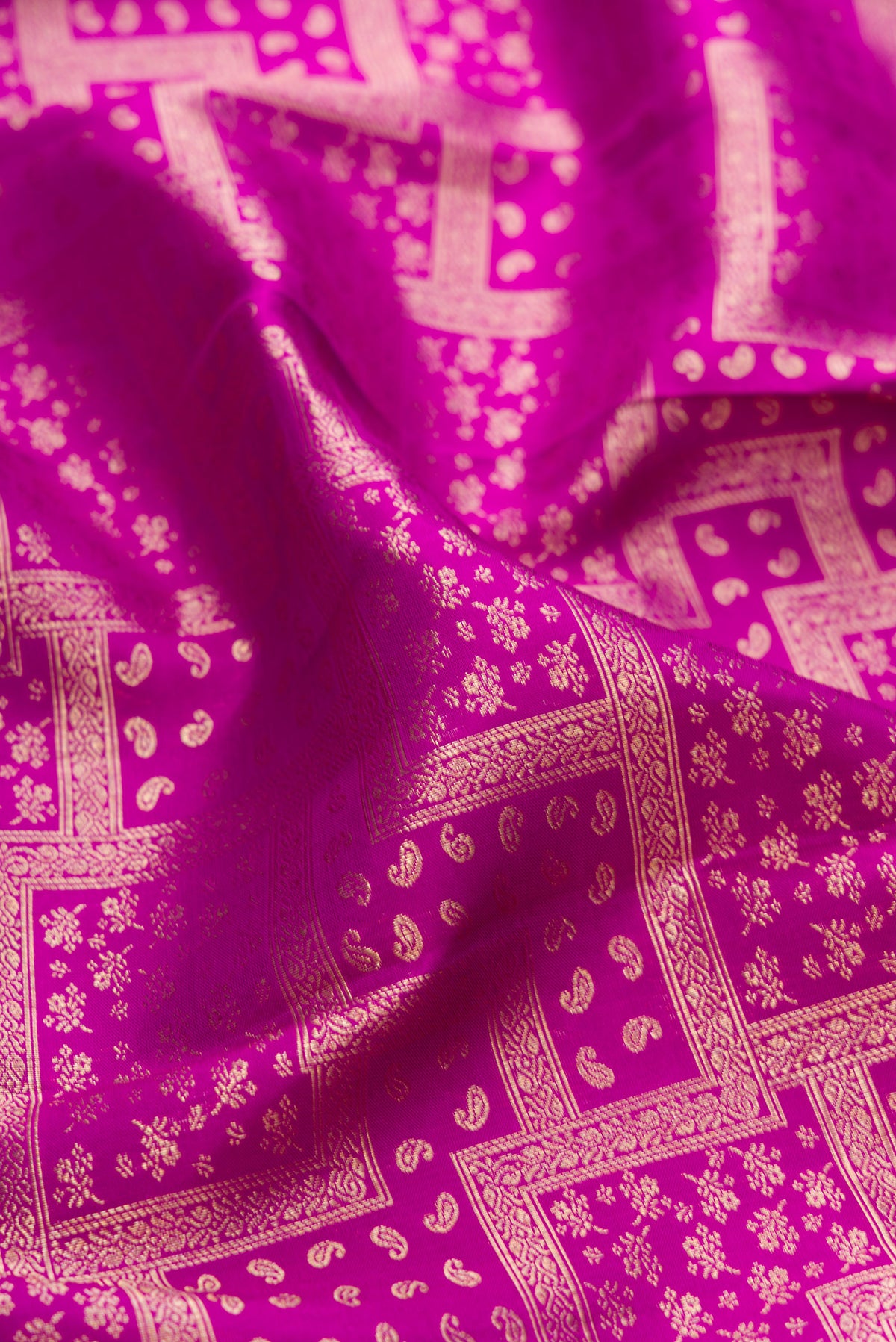 Close up of Purple Kanjivaram Silk Saree with Zari Brocade on the body and Zari Border.  displaying folds