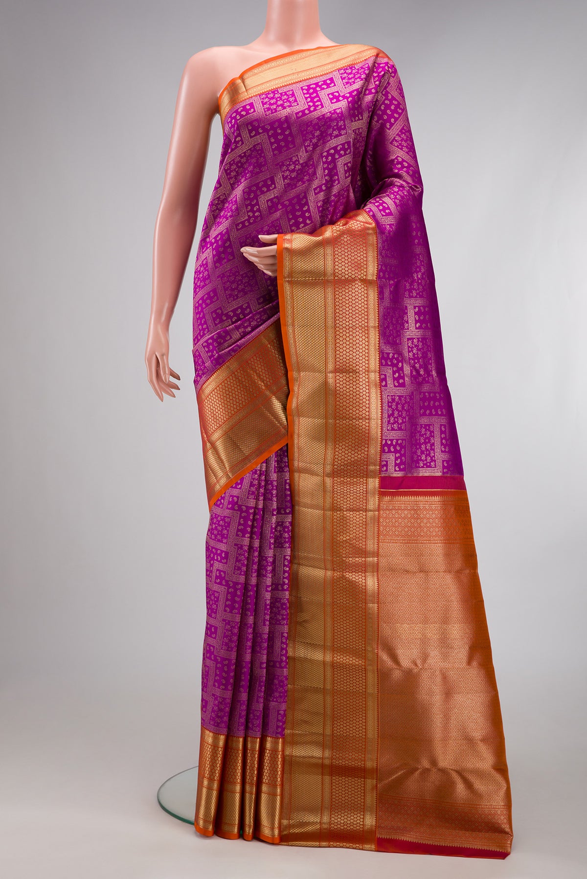 Purple Kanjivaram Silk Saree with Zari Brocade on the body and Zari Border.  displayed on a mannequin