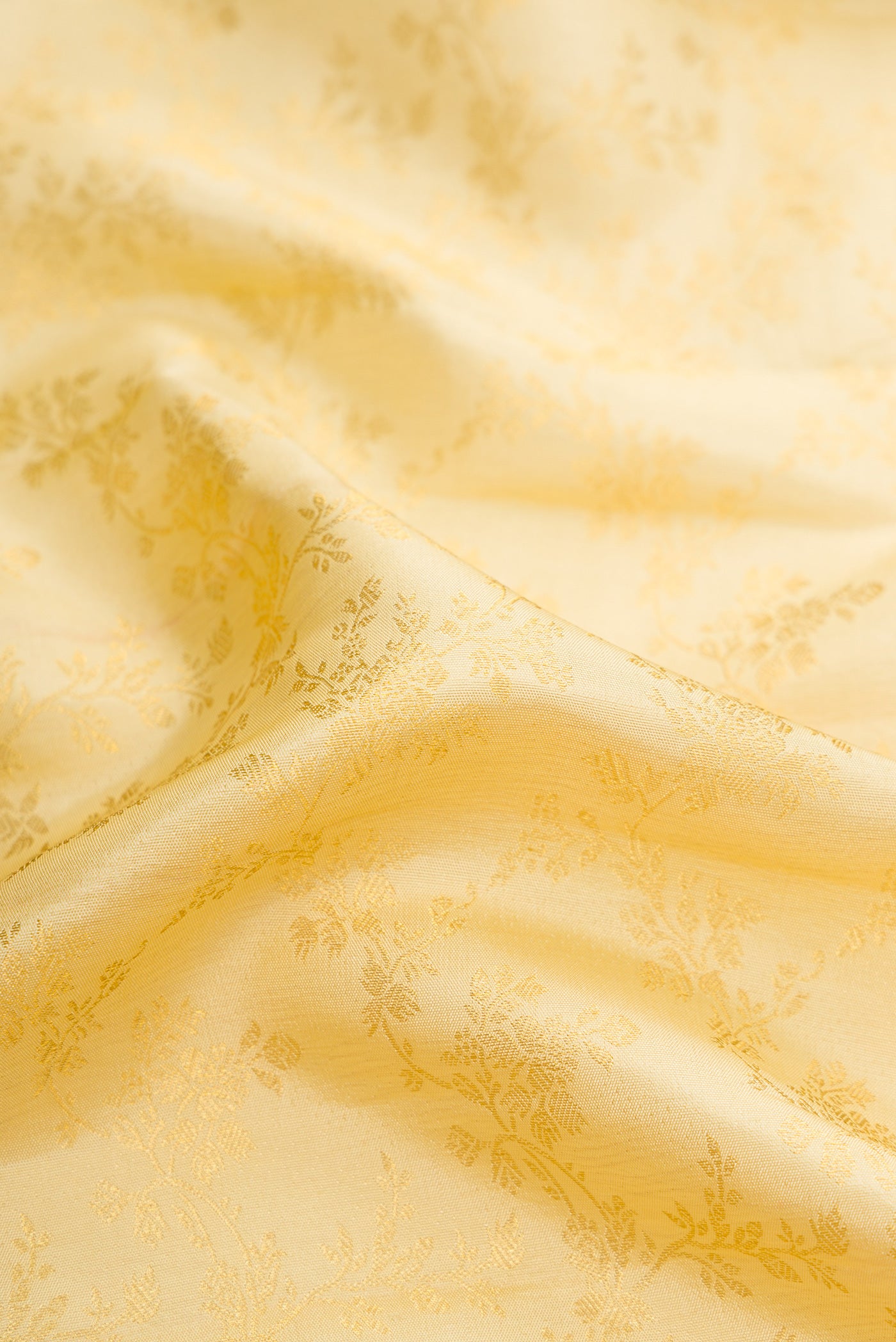 Close up of Sandal Dual Tone Kanjivaram Silk Saree with Zari Brocade on the body and Zari Border.  displaying folds