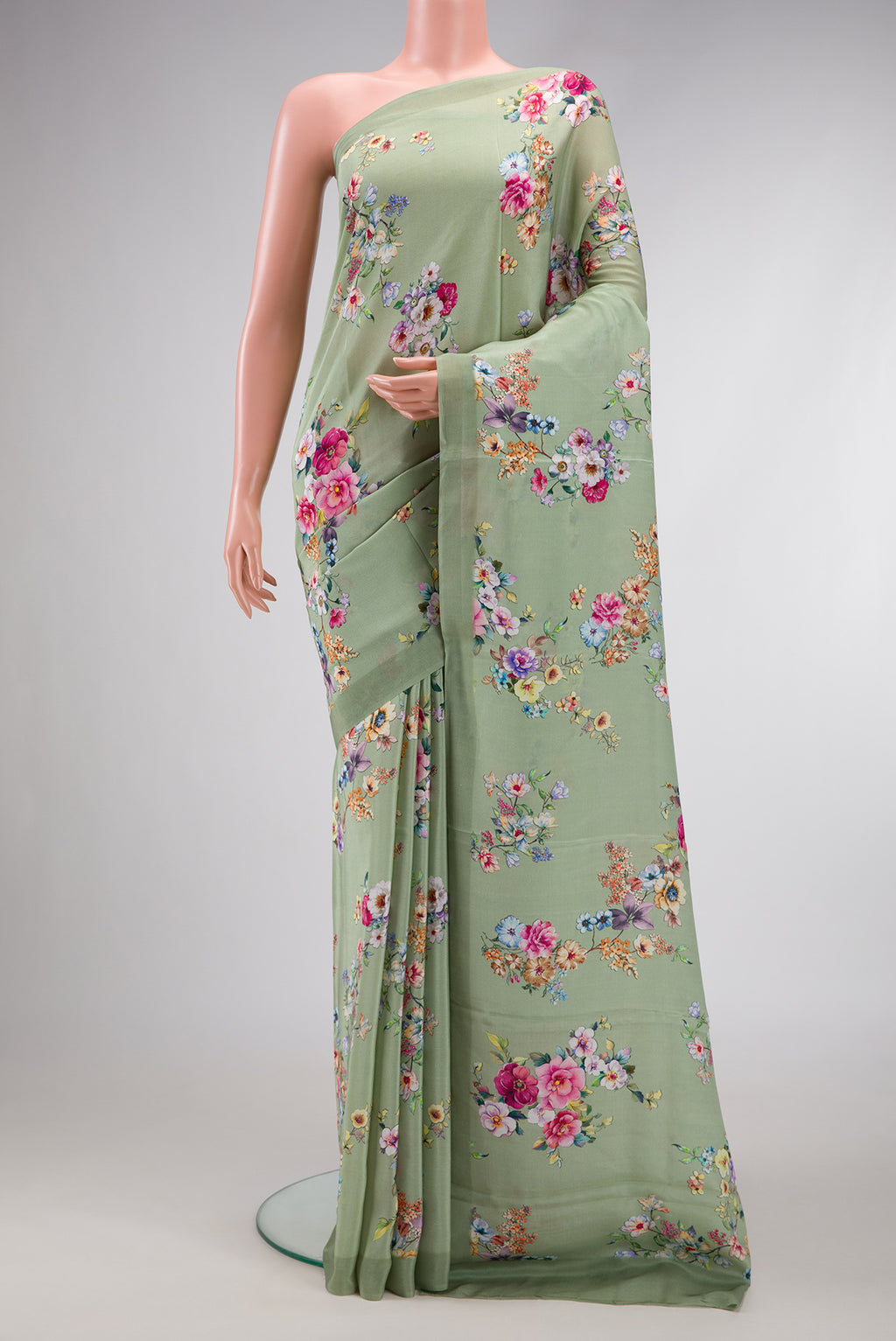 Pista Green Dual Tone Mysore Crepe Saree with Printed design on the body and Plain Border.  displayed on a mannequin