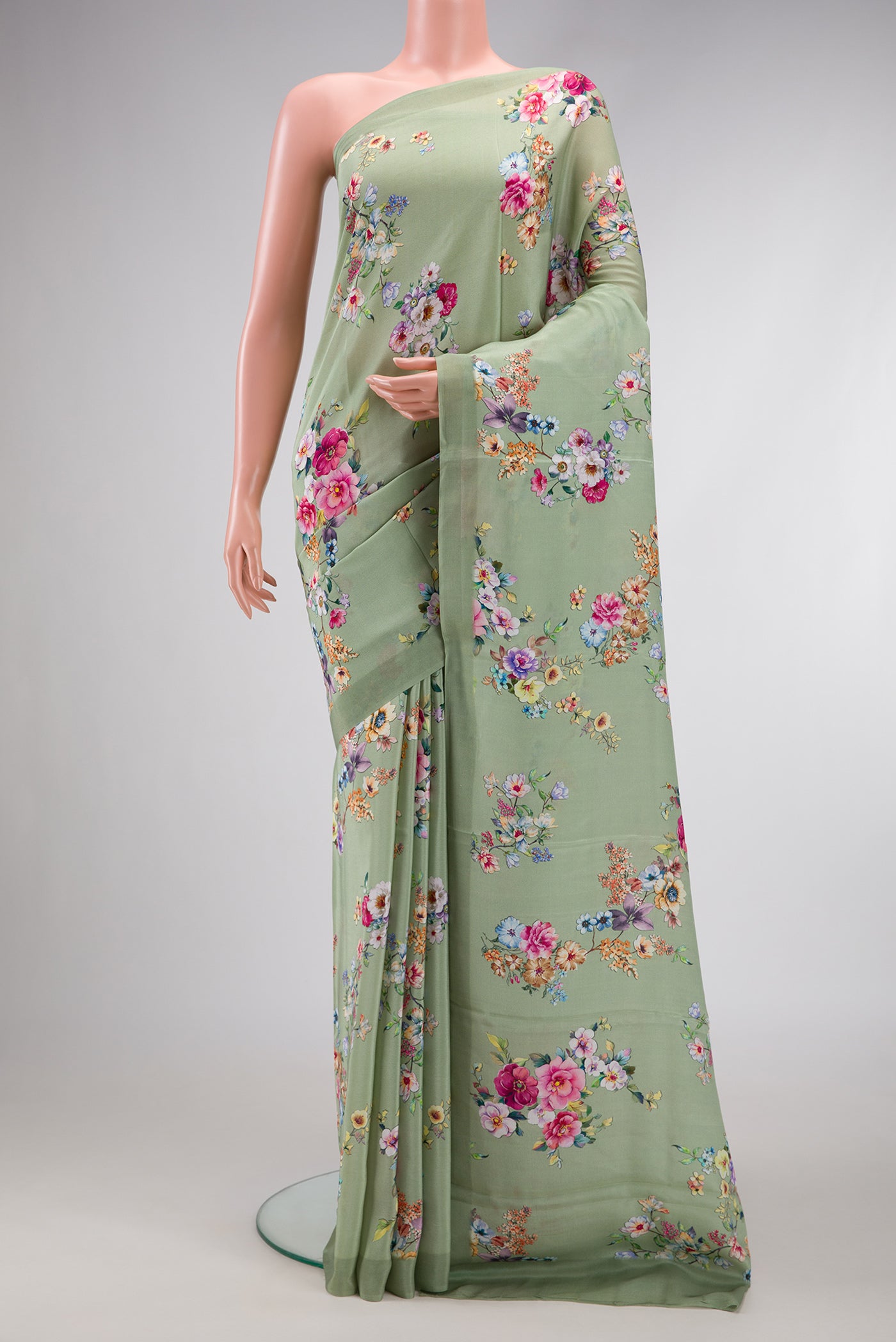 Pista Green Dual Tone Mysore Crepe Saree with Printed design on the body and Plain Border.  displayed on a mannequin