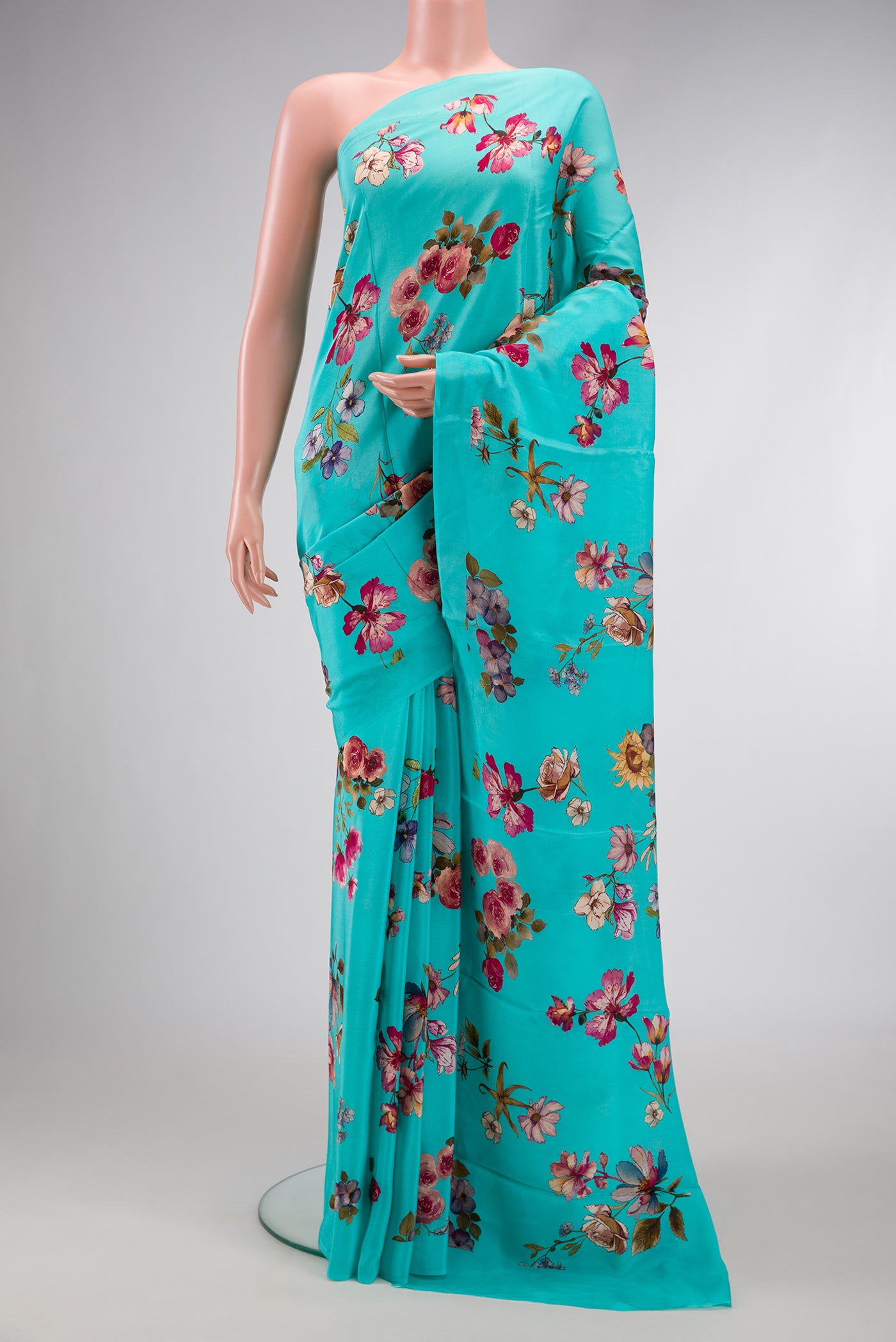 Sky Blue Dual Tone Mysore Crepe Saree with Printed design on the body and Without Border.  displayed on a mannequin