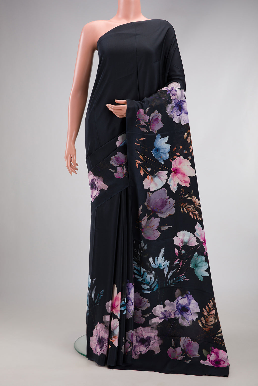 Black Crepe Saree with Plain Body and Printed Border.  displayed on a mannequin
