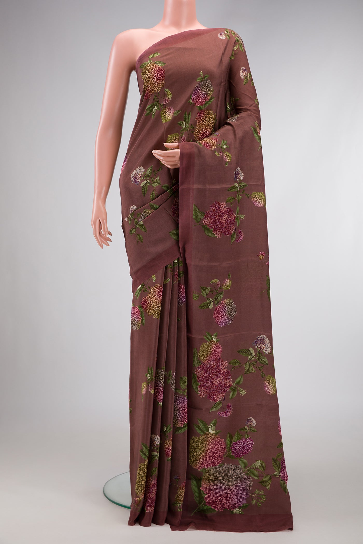 Brown Dual Tone Mysore Crepe Saree with Printed design on the body and Plain Border.  displayed on a mannequin
