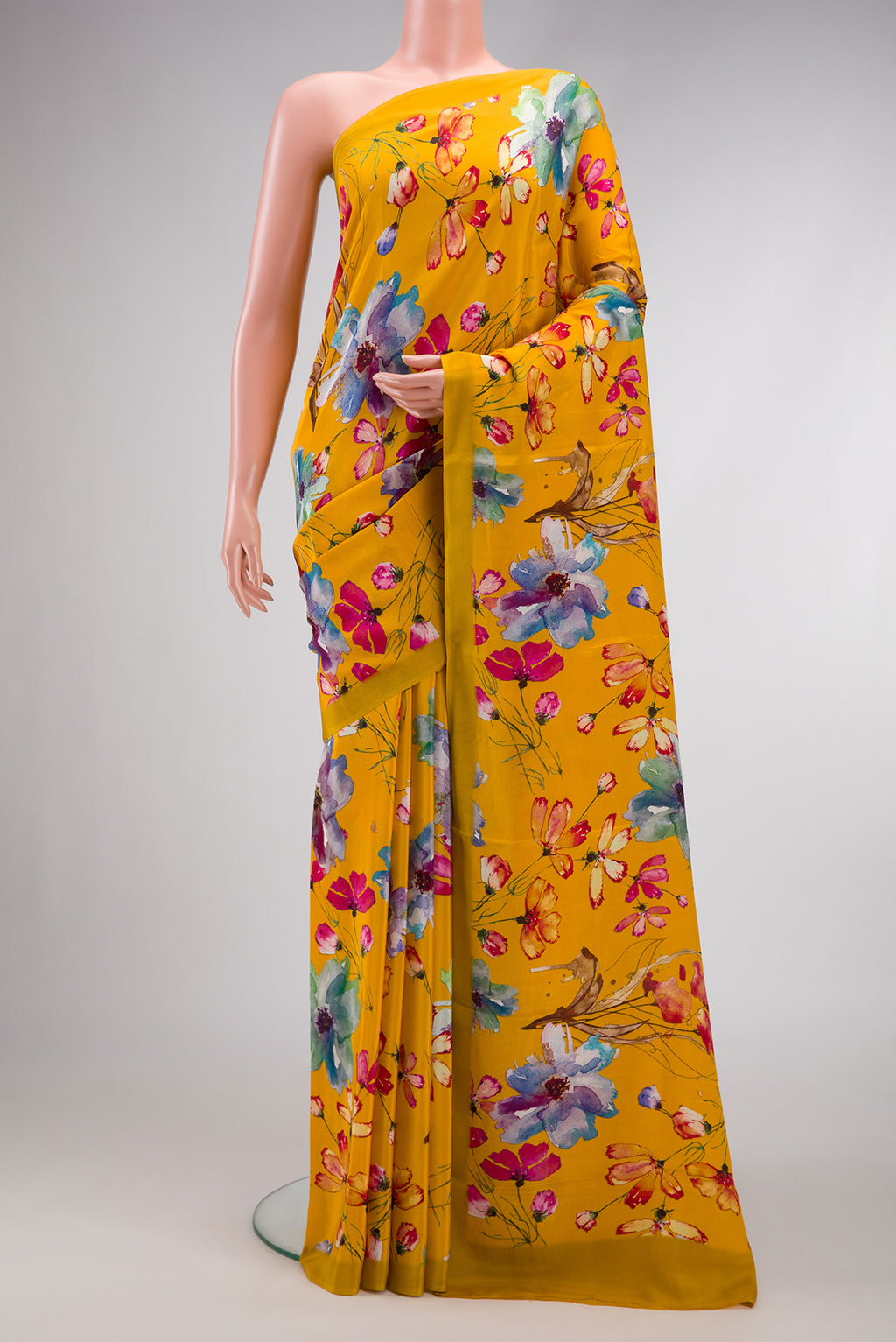 Mustard Dual Tone Mysore Crepe Saree with Printed design on the body and Plain Border.  displayed on a mannequin