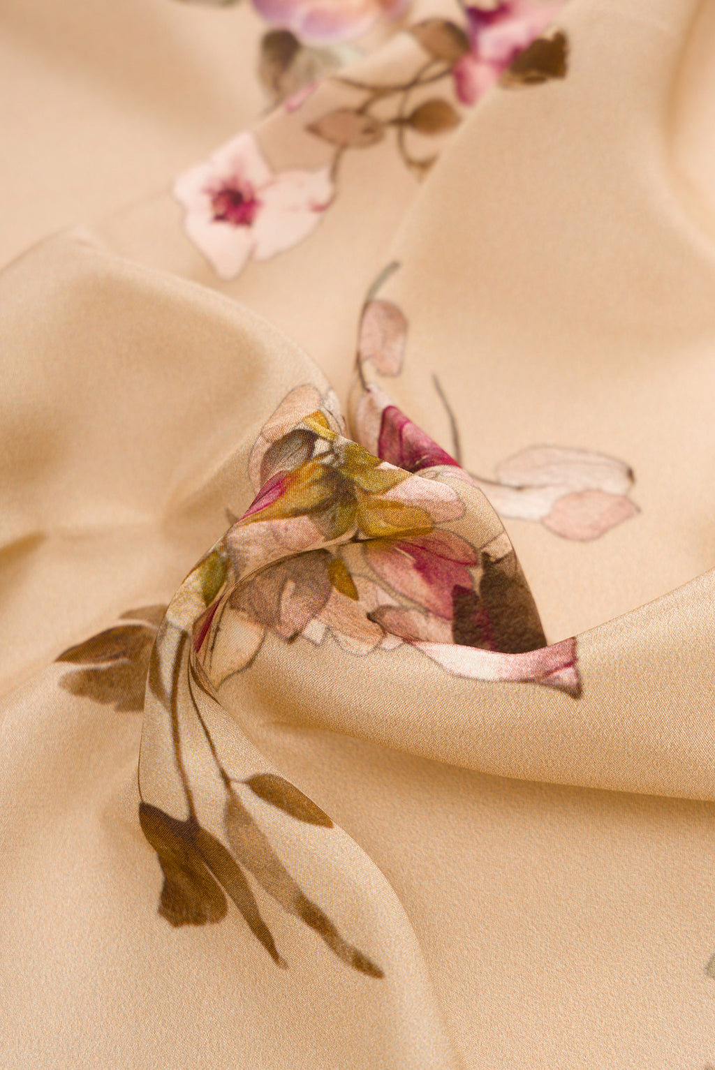 Close up of Beige Dual Tone Mysore Crepe Saree with Printed design on the body and Plain Border.  displaying folds