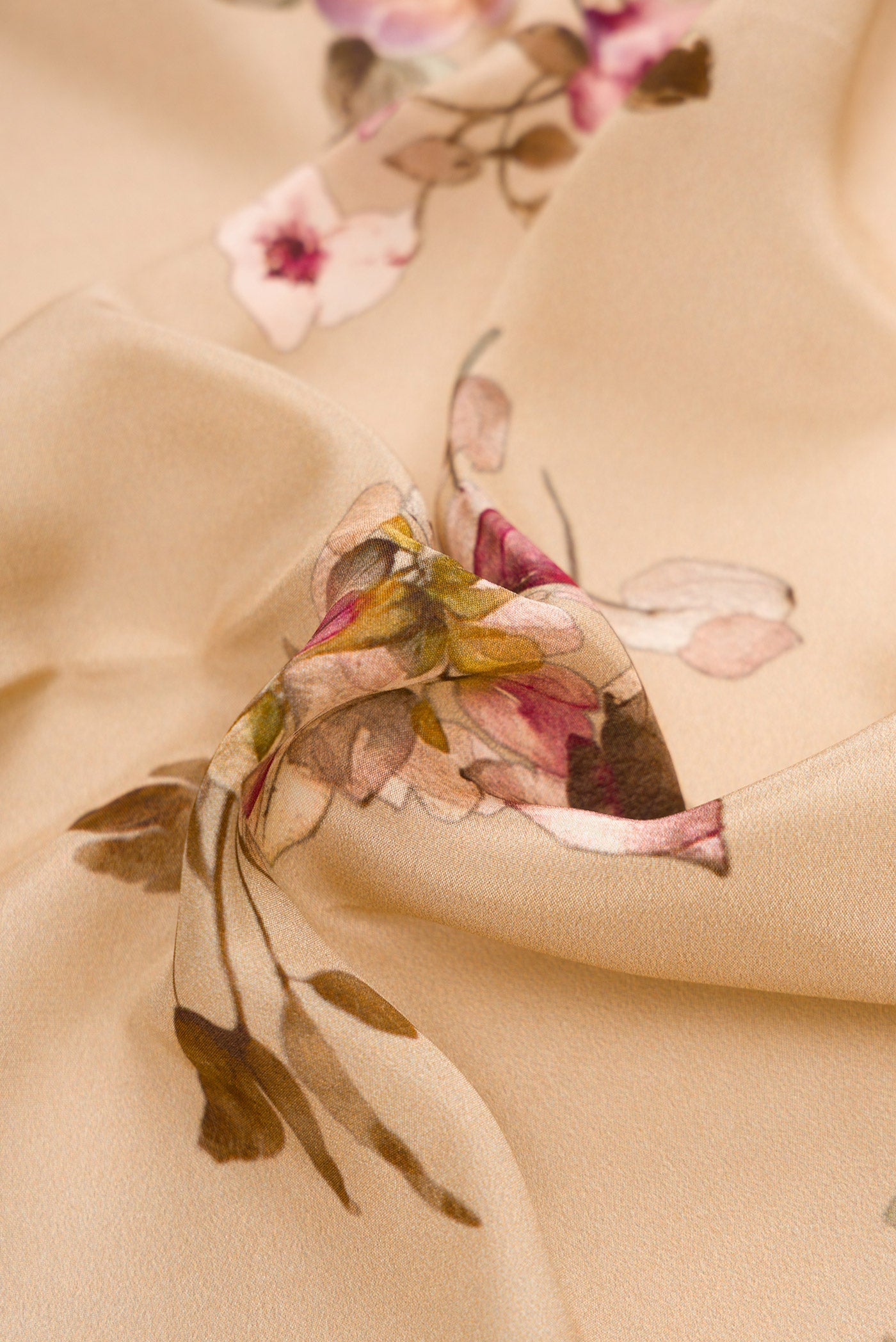 Close up of Beige Dual Tone Mysore Crepe Saree with Printed design on the body and Plain Border.  displaying folds