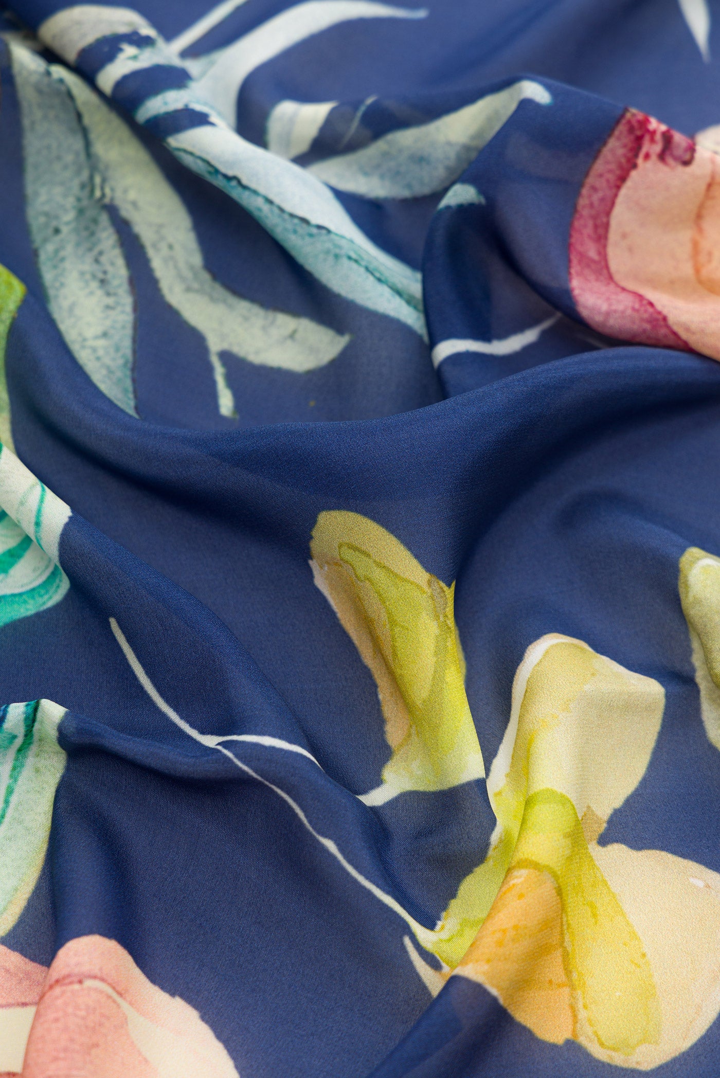 Close up of Navy Blue Dual Tone Mysore Crepe Saree with Printed design on the body and Without Border.  displaying folds