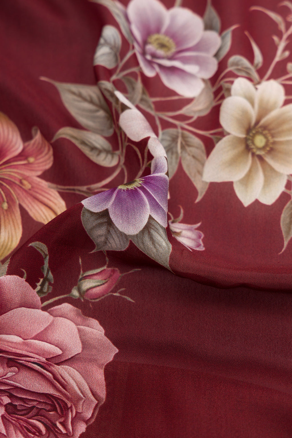 Close up of Brown Dual Tone Mysore Crepe Saree with Printed design on the body and Printed Border.  displaying folds