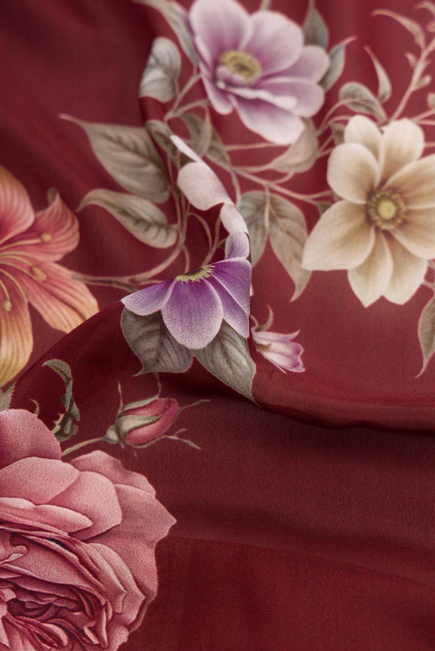 Close up of Brown Dual Tone Mysore Crepe Saree with Printed design on the body and Printed Border.  displaying folds