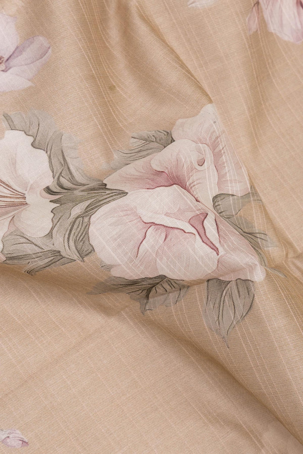 Close up of Pure Silk Beige Dual Tone Chanderi Saree with Printed design on the body and Zari And Thread Border.  displaying folds
