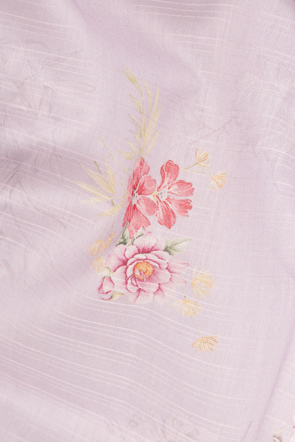 Close up of Pure Silk Lavender Dual Tone Chanderi Saree with Printed design on the body and Zari And Thread Border.  displaying folds