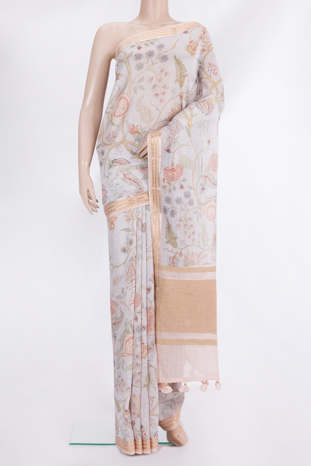 Beige Chanderi Cotton Saree with Floral Print on the body and Zari And Thread Border.  displayed on a mannequin