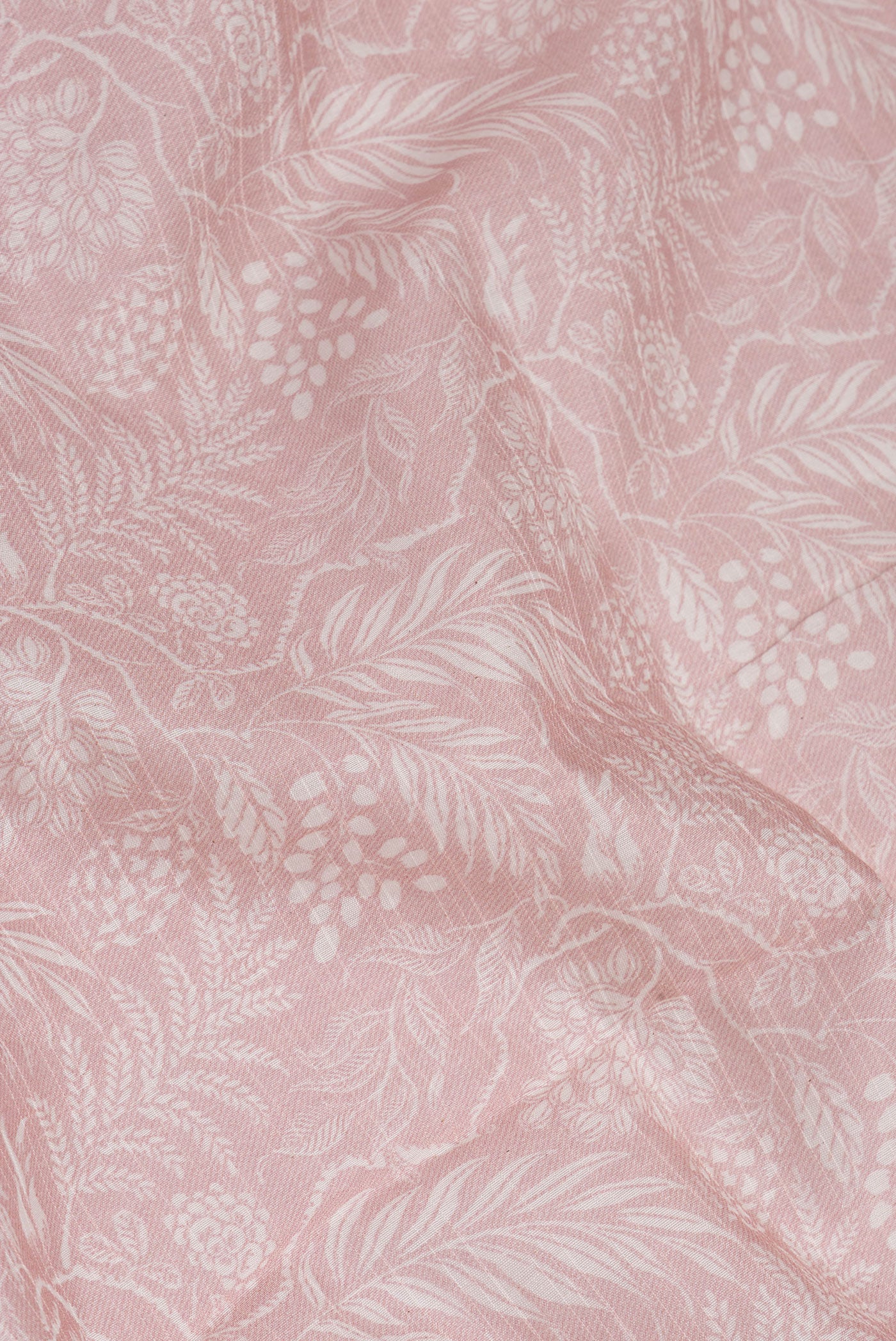 Close up of Rose Gold Dual Tone Chanderi Silk Saree with Printed design on the body and Zari Border.  displaying folds