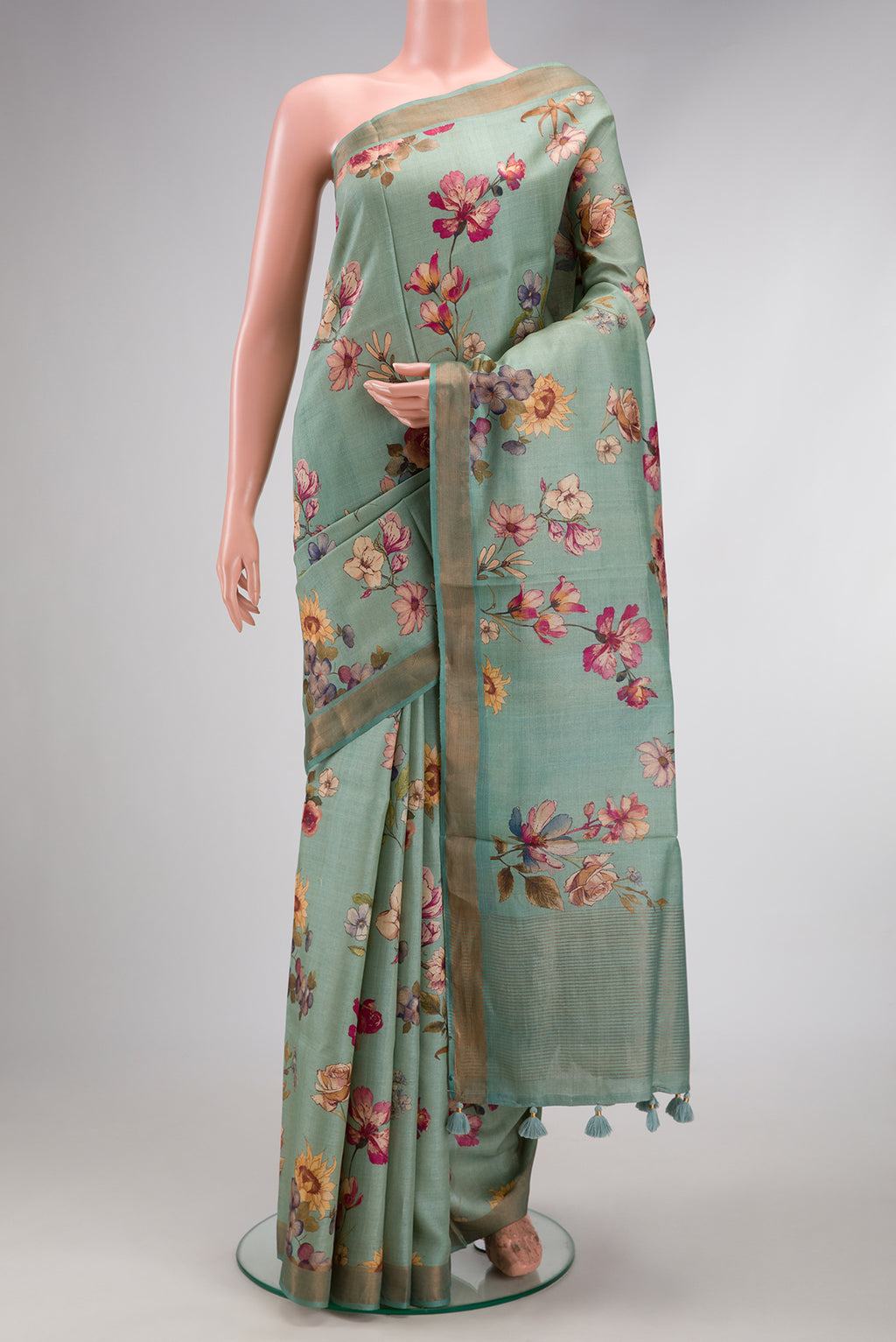 Sea Green Dual Tone Tussar Silk Saree with Printed design on the body and Zari Border.  displayed on a mannequin