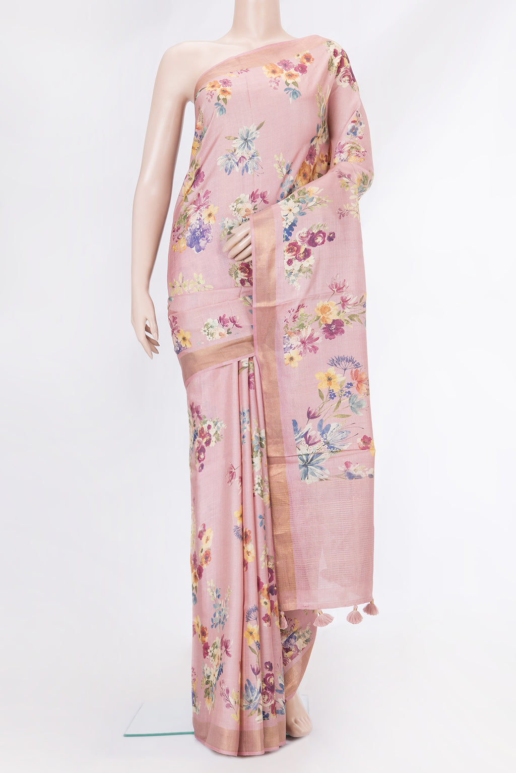 Pink Tussar Silk Saree with Floral Print on the body and Zari Border.  displayed on a mannequin