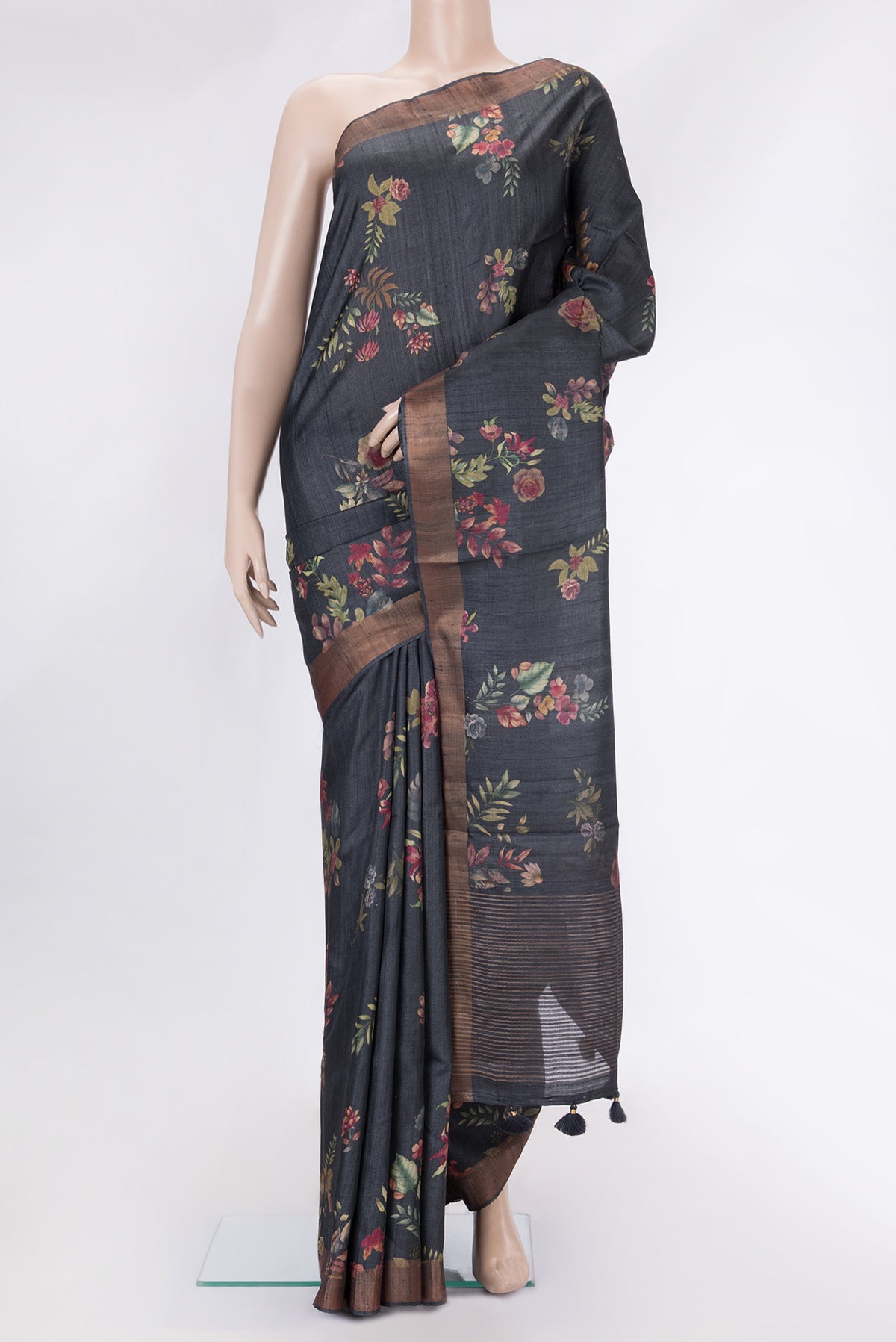 Black Dual Tone Tussar Silk Saree with Printed design on the body and Zari Border.  displayed on a mannequin