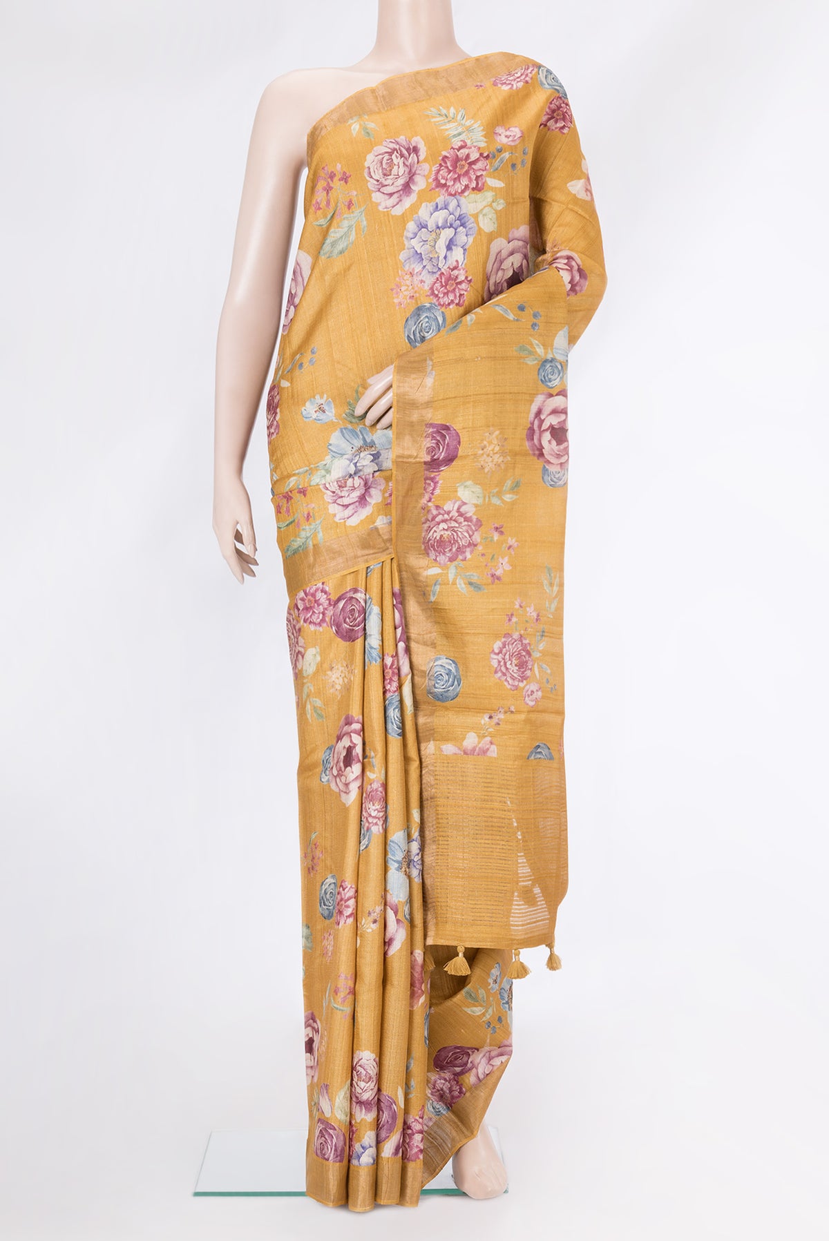 Mustard Dual Tone Tussar Silk Saree with Printed design on the body and Zari Border.  displayed on a mannequin