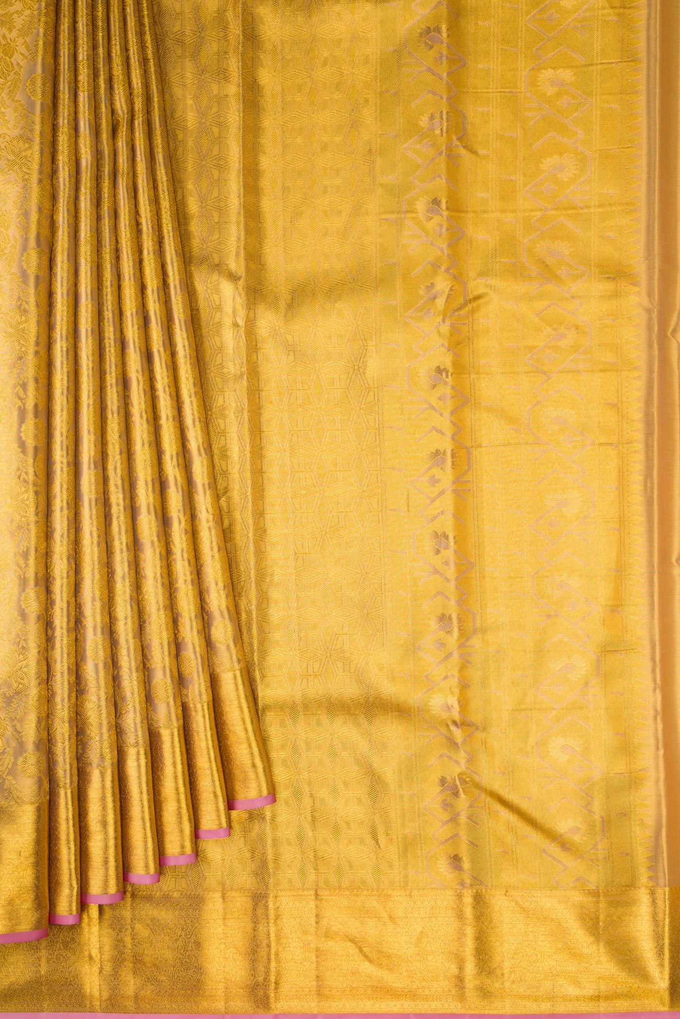 Pleats and pallu of Gold Dual Tone Kanchipuram Tissue Silk Saree with Zari Brocade on the body and Zari Border. 