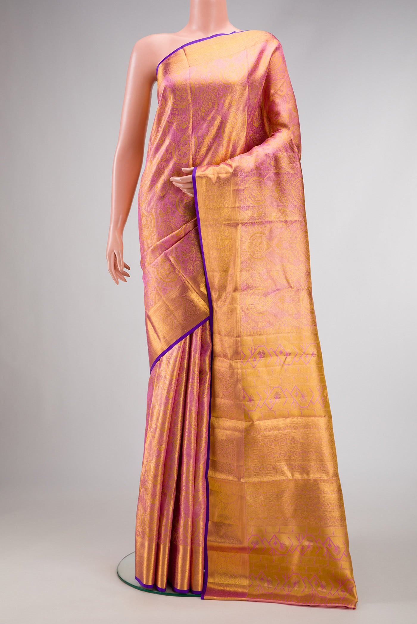 Pink Dual Tone Kanchipuram Tissue Silk Saree with Zari Brocade on the body and Zari Border.  displayed on a mannequin
