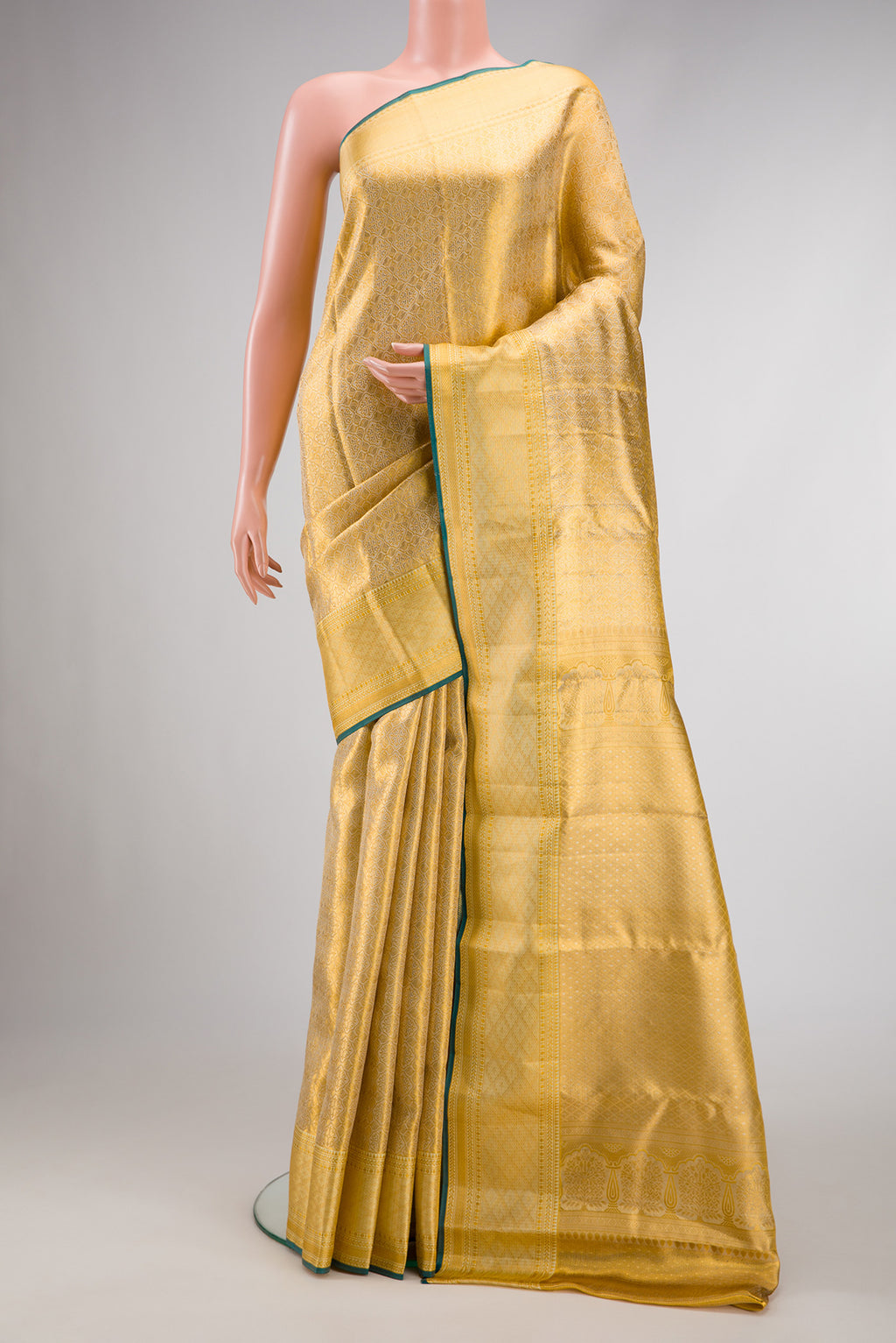 Gold Dual Tone Kanjivaram Tissue Silk Saree with Zari Brocade on the body and Zari Border.  displayed on a mannequin