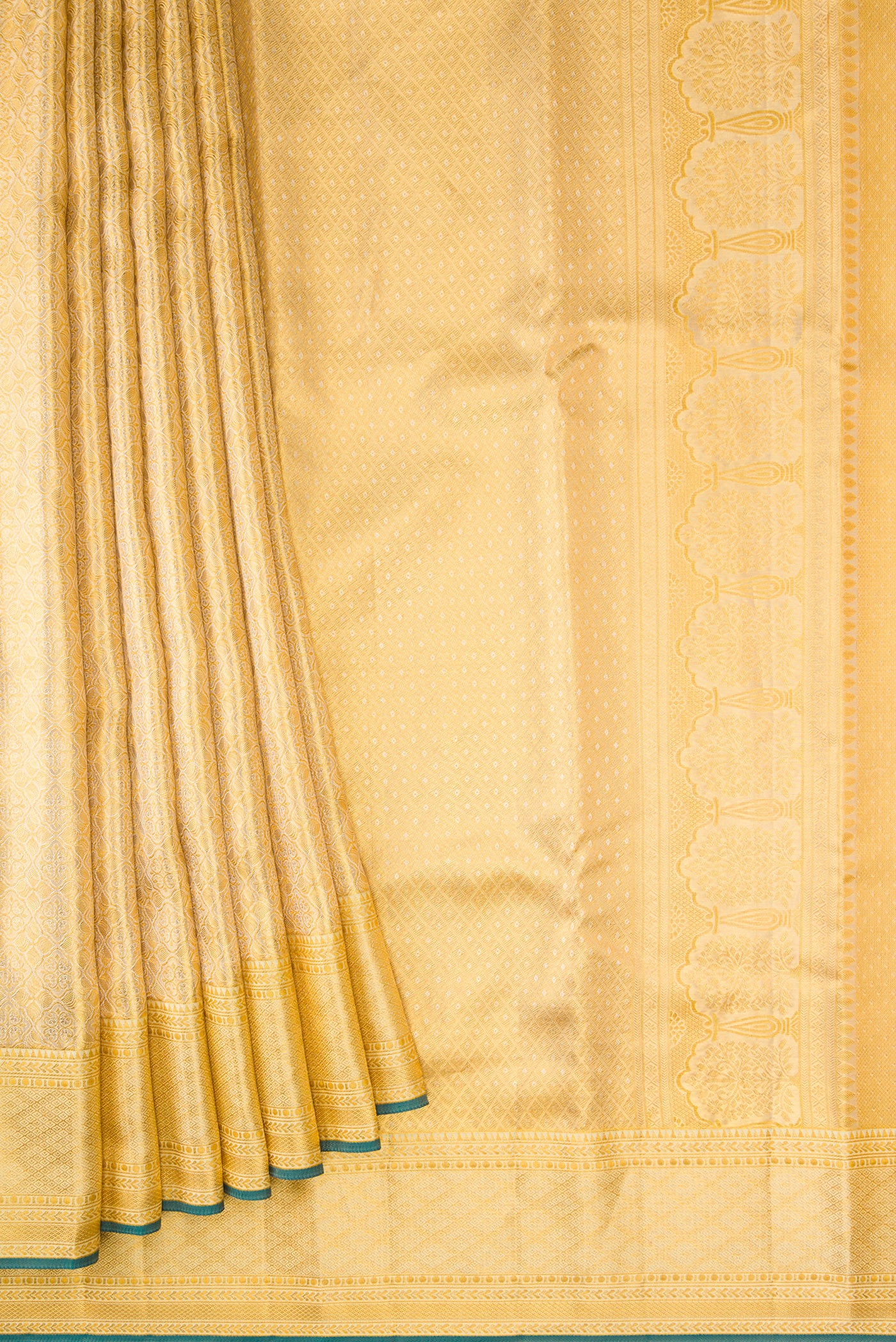 Pleats and pallu of Gold Dual Tone Kanjivaram Tissue Silk Saree with Zari Brocade on the body and Zari Border. 