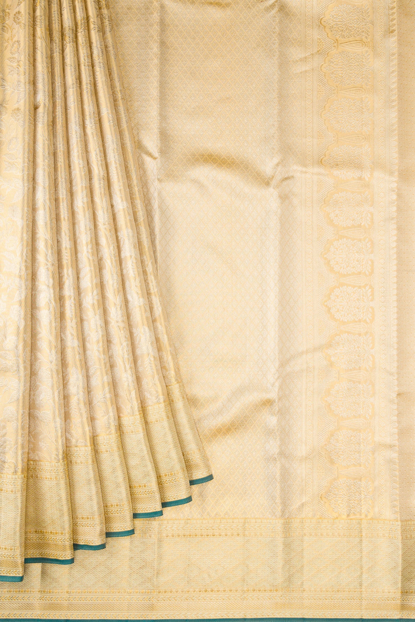 Pleats and pallu of Gold Dual Tone Kanjivaram Tissue Silk Saree with Zari Butta on the body and Zari Border. 