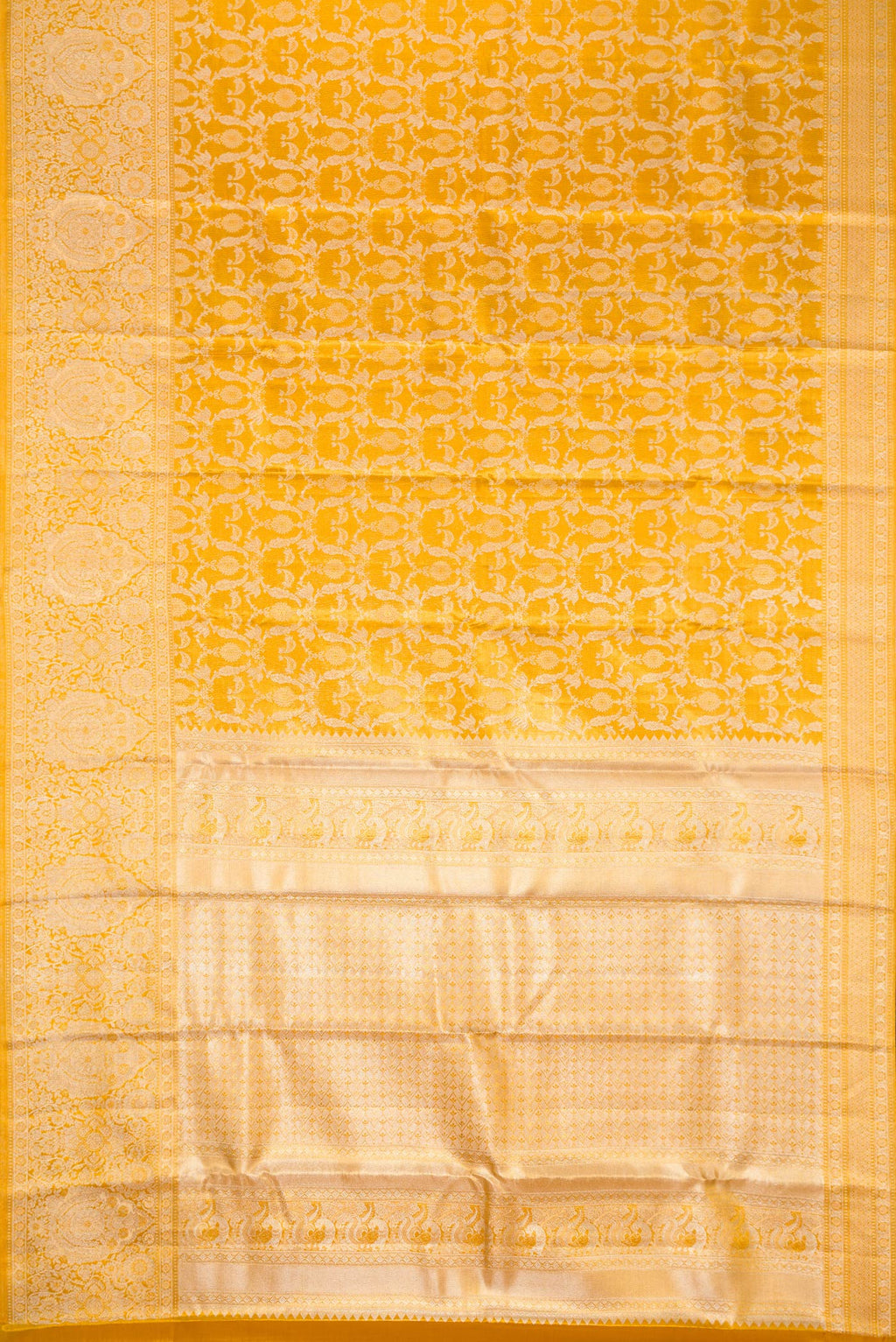 Flat view of Gold Dual Tone Kanjivaram Tissue Silk Saree with Zari Brocade on the body and Zari Border. 