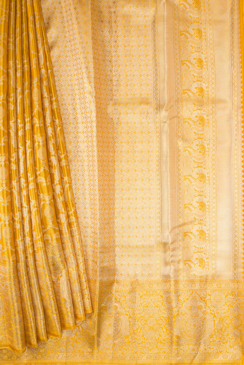 Pleats and pallu of Gold Dual Tone Kanjivaram Tissue Silk Saree with Zari Brocade on the body and Zari Border. 