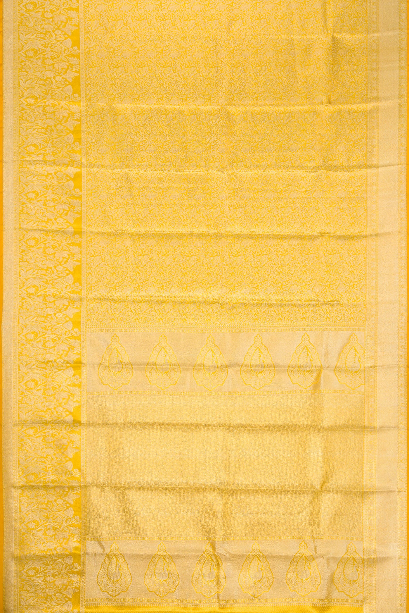 Flat view of Gold Dual Tone Kanjivaram Tissue Silk Saree with Zari Brocade on the body and Zari Border. 