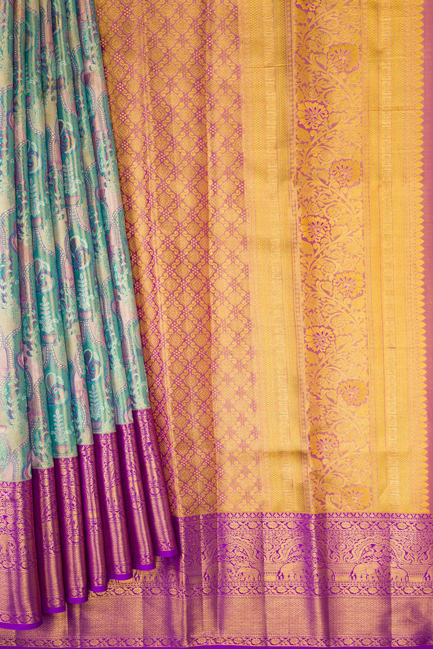 Pleats and pallu of Green Dual Tone Kanjivaram Tissue Silk Saree with Zari Brocade on the body and Zari Border. 