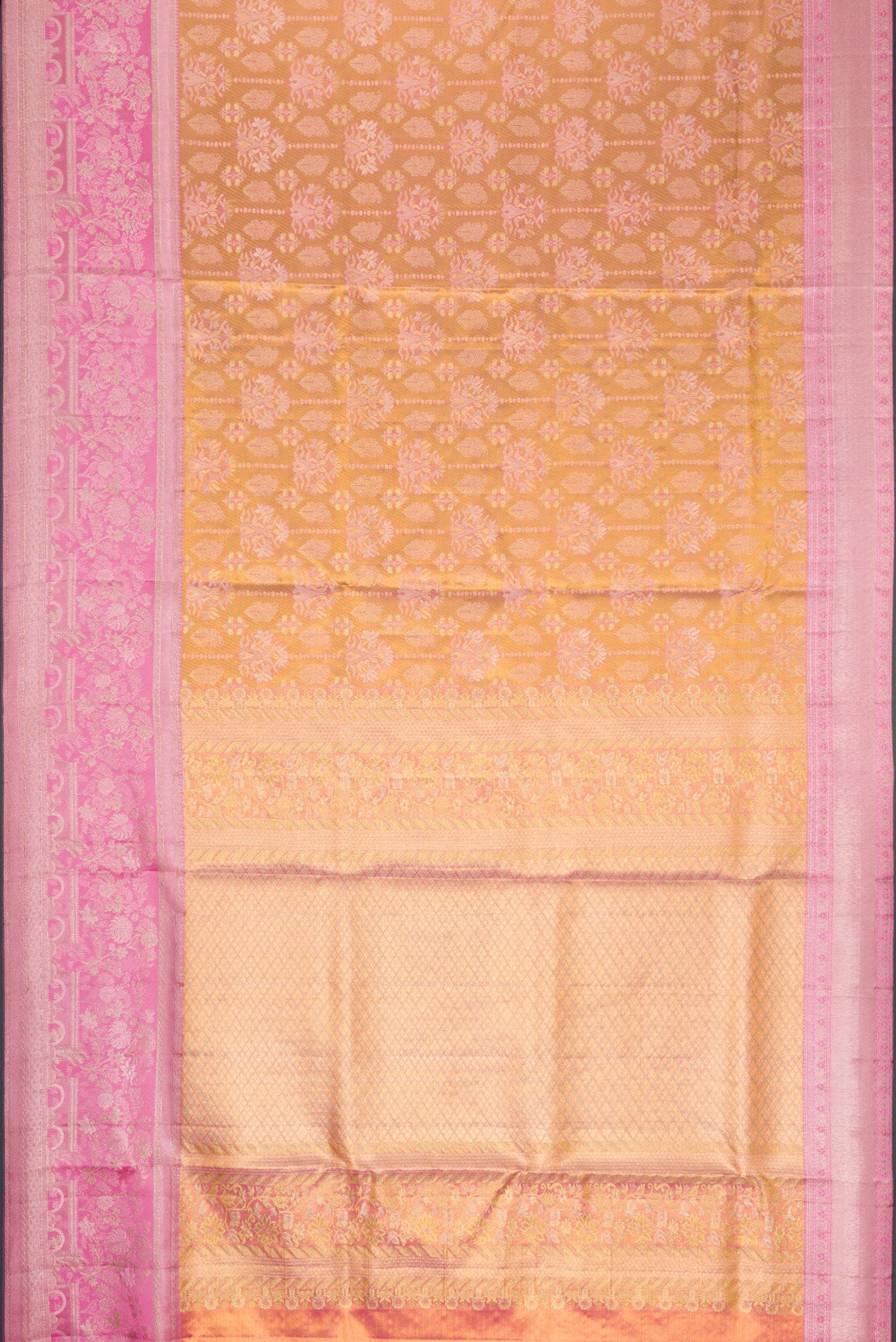 Flat view of Gold Dual Tone Kanjivaram Tissue Silk Saree with Zari Brocade on the body and Zari Border. 