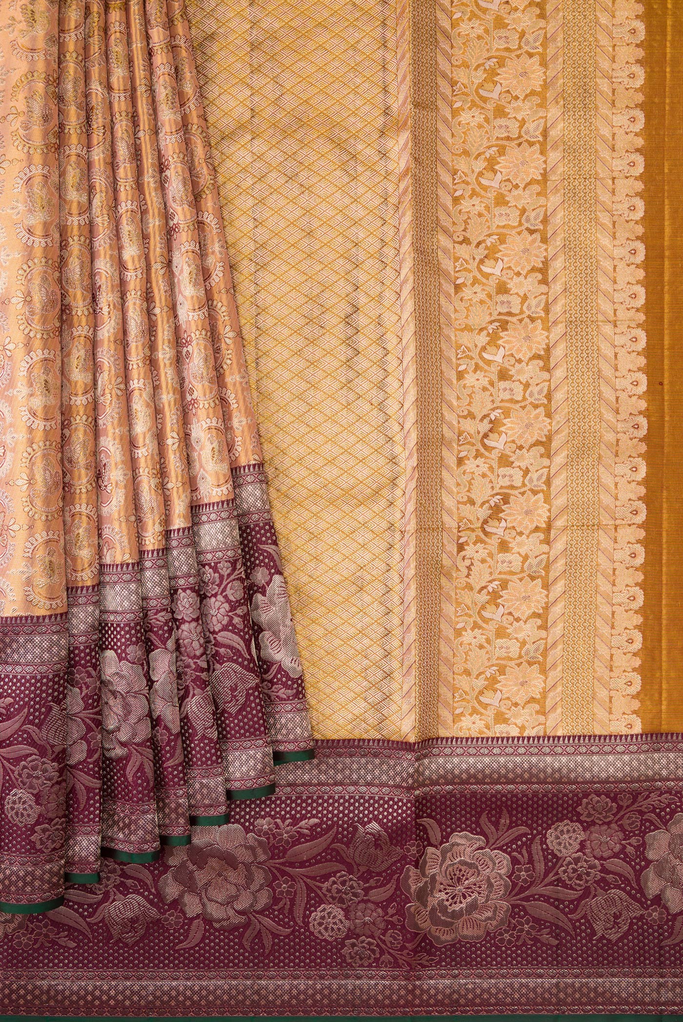 Pleats and pallu of Gold Dual Tone Kanjivaram Tissue Silk Saree with Zari Brocade on the body and Zari Border. 