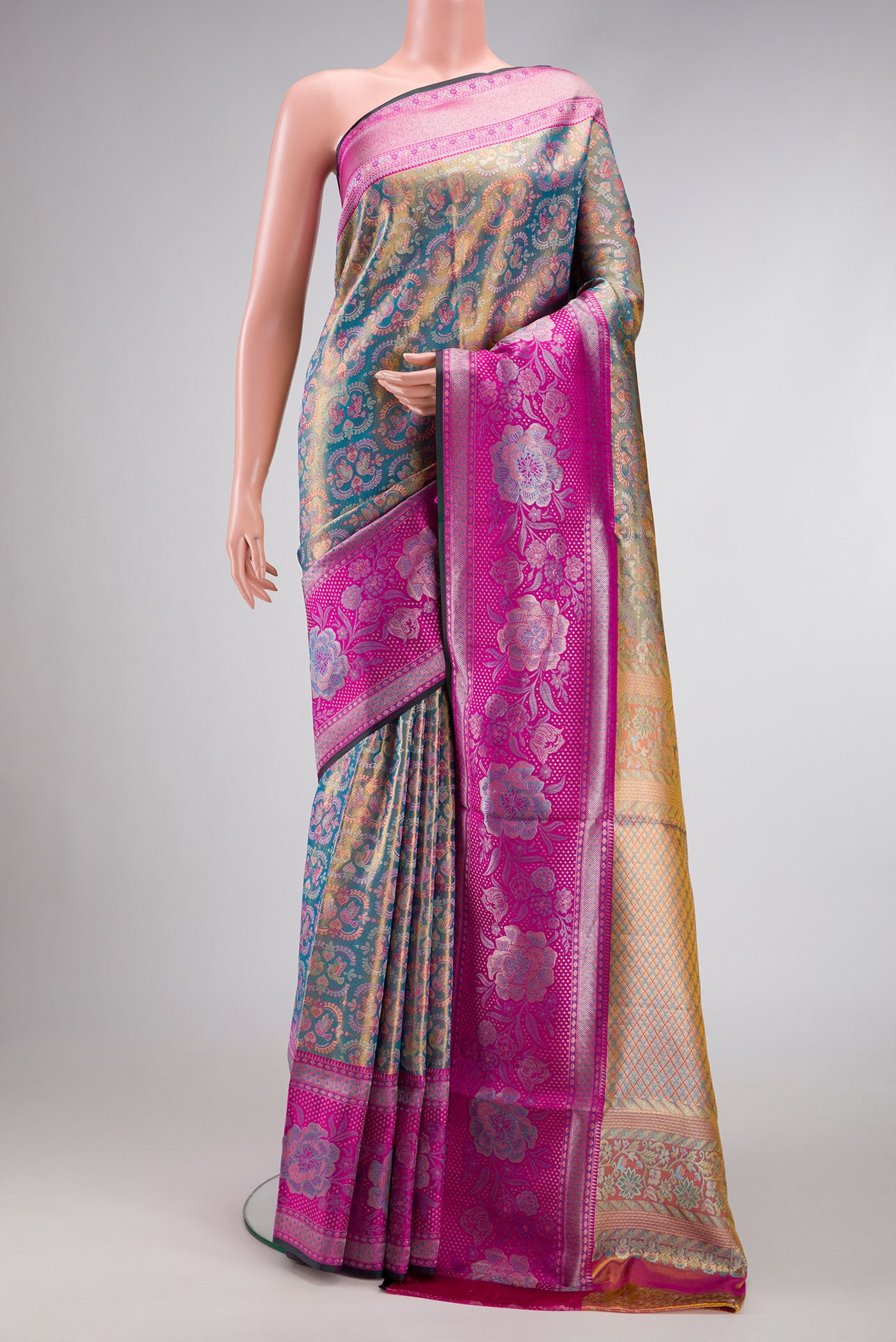 Blue Dual Tone Kanjivaram Tissue Silk Saree with Zari Brocade on the body and Zari Border.  displayed on a mannequin