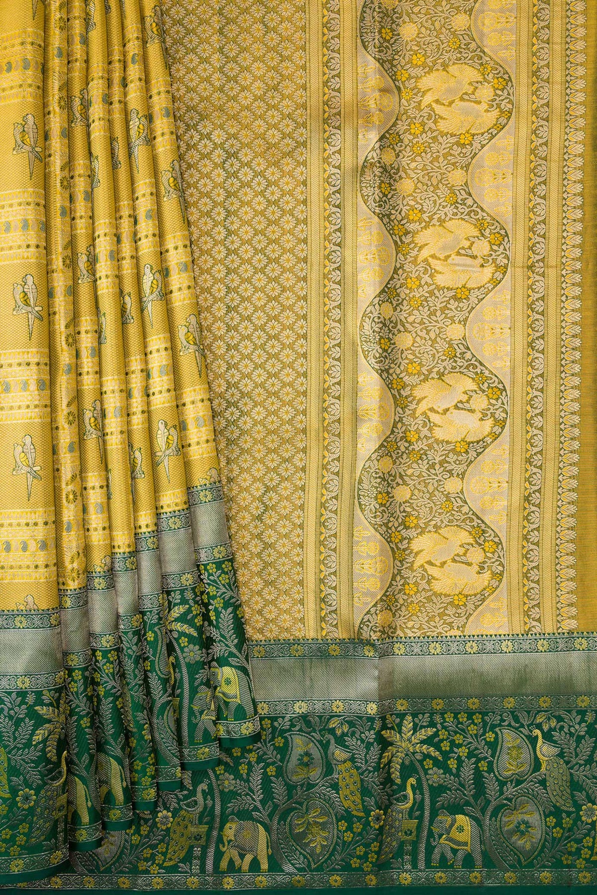 Pleats and pallu of Gold Dual Tone Kanjivaram Tissue Silk Saree with Zari Brocade on the body and Zari Border. 