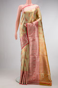 Pista Green Dual Tone Kanjivaram Tissue Silk Saree with Zari Brocade on the body and Zari Border.  displayed on a mannequin