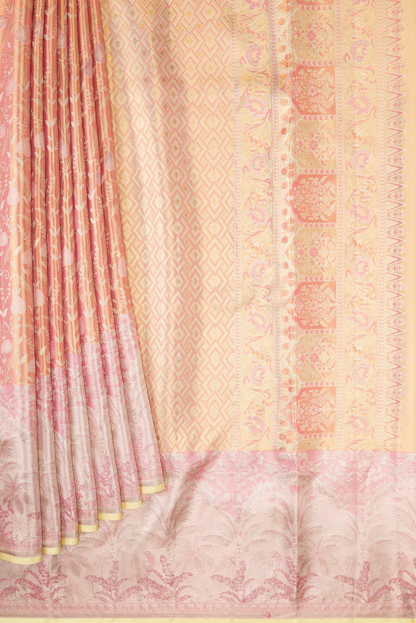 Pleats and pallu of Rose Gold Dual Tone Kanjivaram Tissue Silk Saree with Zari Brocade on the body and Fancy Border. 