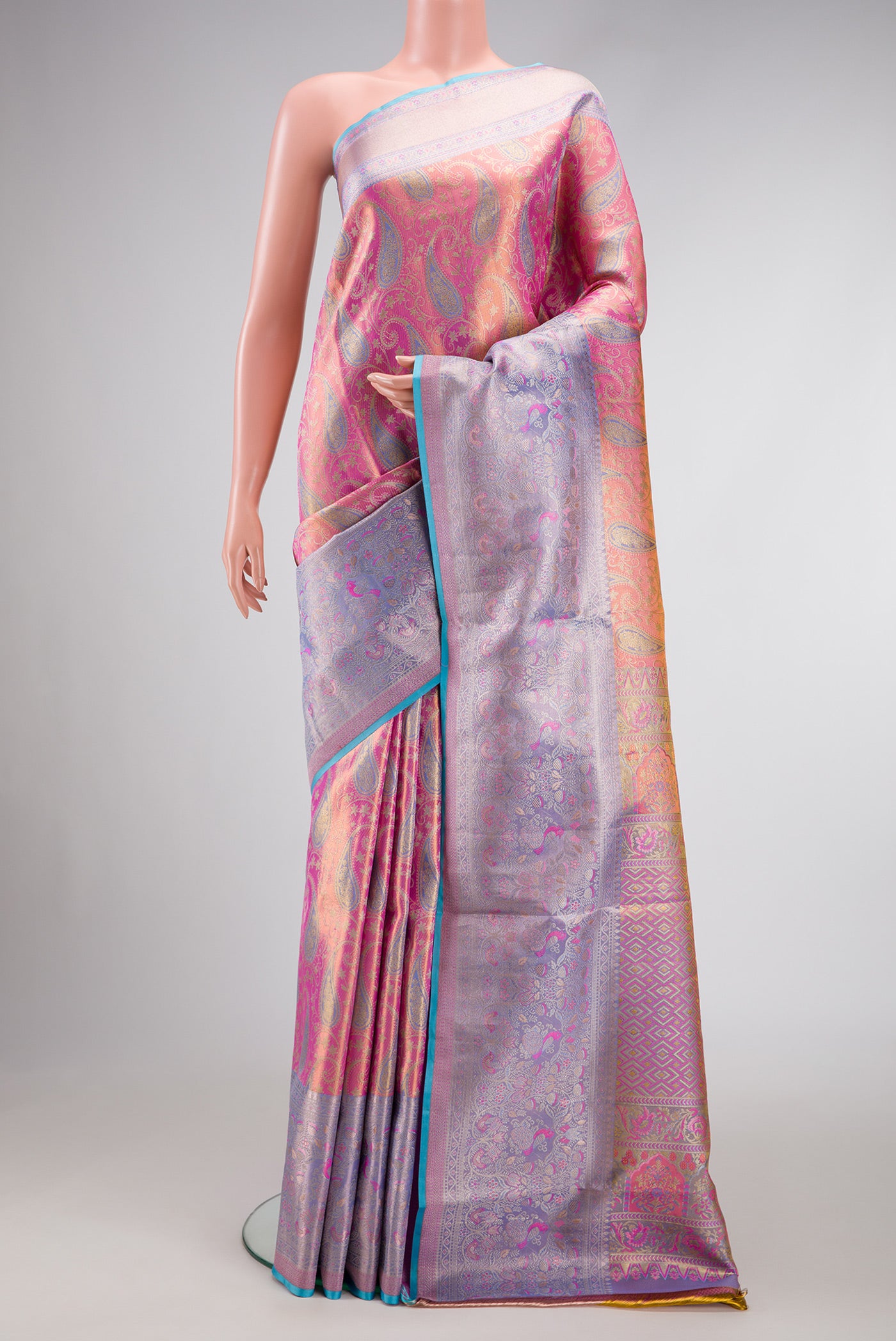 Pink Dual Tone Kanjivaram Tissue Silk Saree with Zari Brocade on the body and Zari Border.  displayed on a mannequin