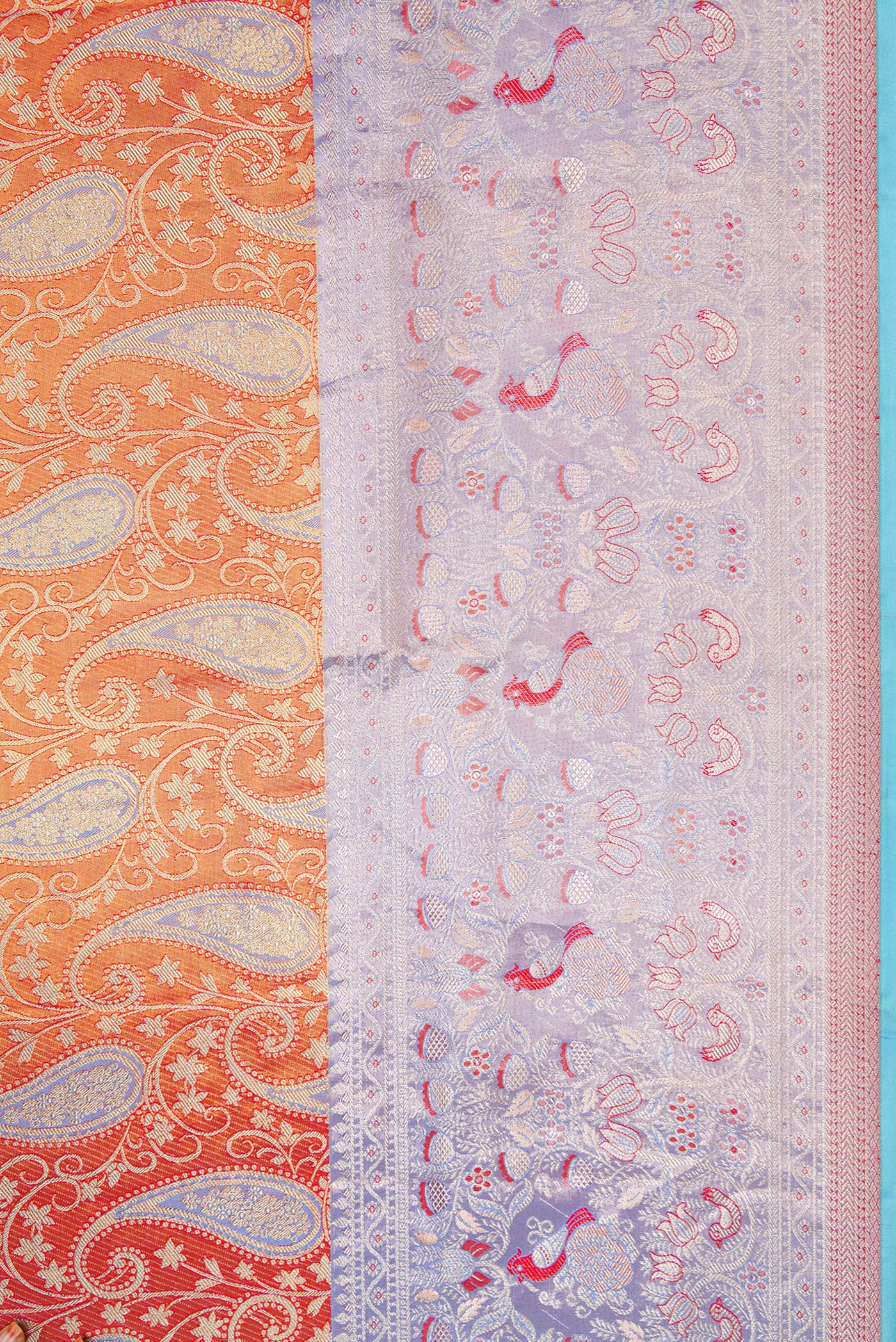 Border image of Orange Dual Tone Kanjivaram Tissue Silk Saree with Zari Brocade on the body and Fancy Border. 