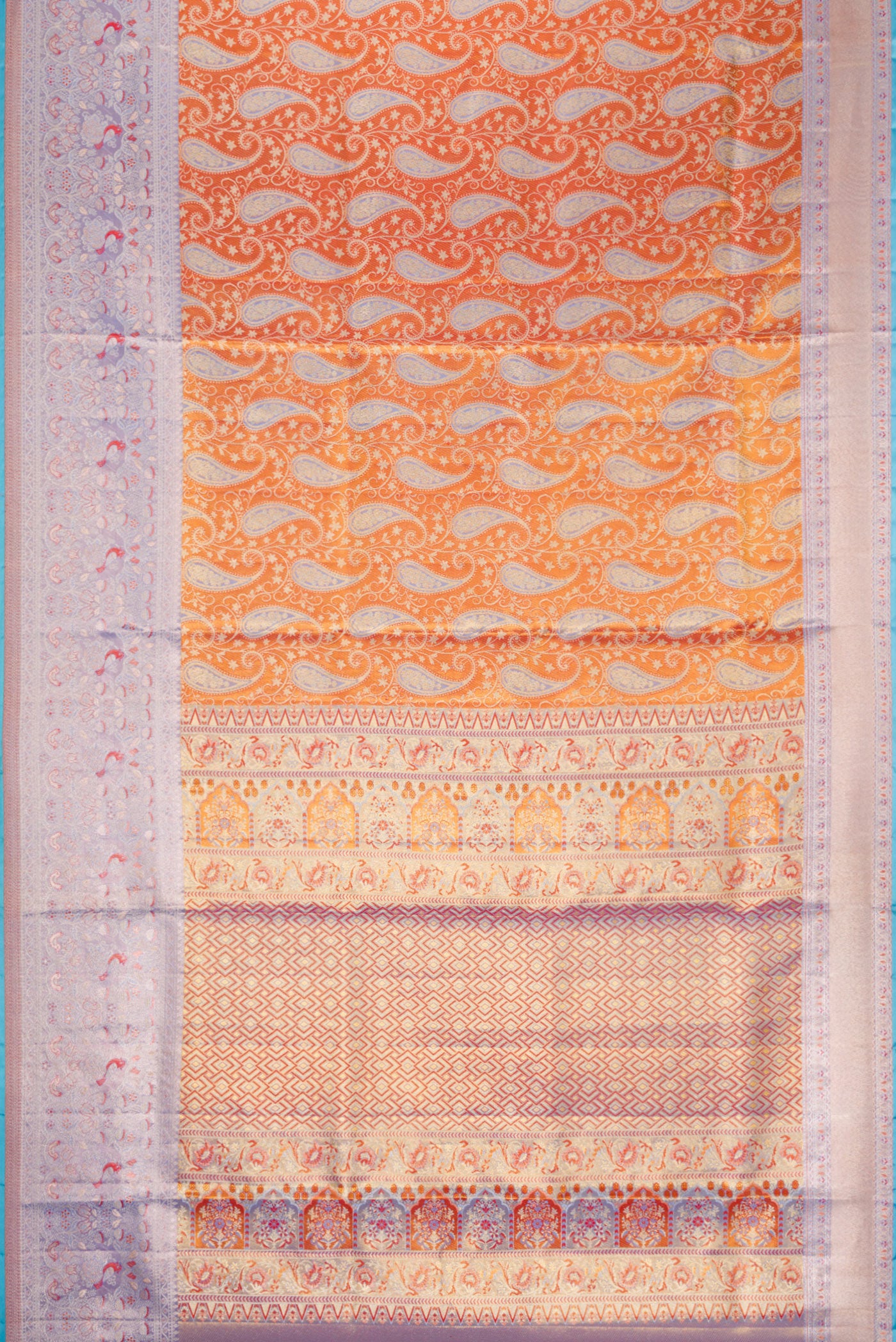 Flat view of Orange Dual Tone Kanjivaram Tissue Silk Saree with Zari Brocade on the body and Fancy Border. 