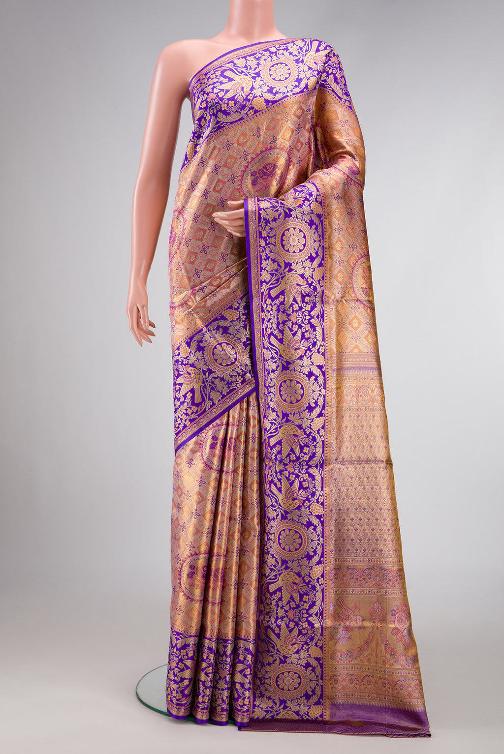 Peach Dual Tone Kanjivaram Tissue Silk Saree with Zari Brocade on the body and Fancy Border.  displayed on a mannequin