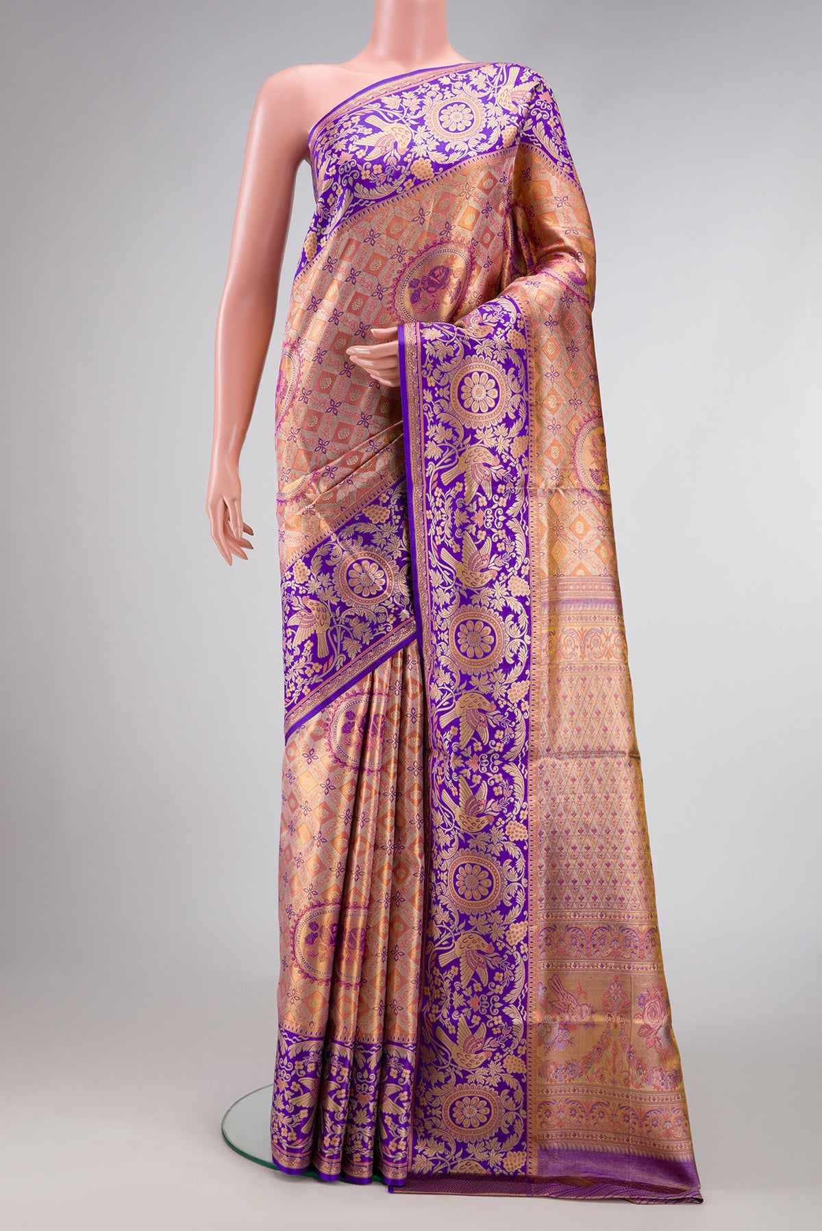 Peach Dual Tone Kanjivaram Tissue Silk Saree with Zari Brocade on the body and Fancy Border.  displayed on a mannequin