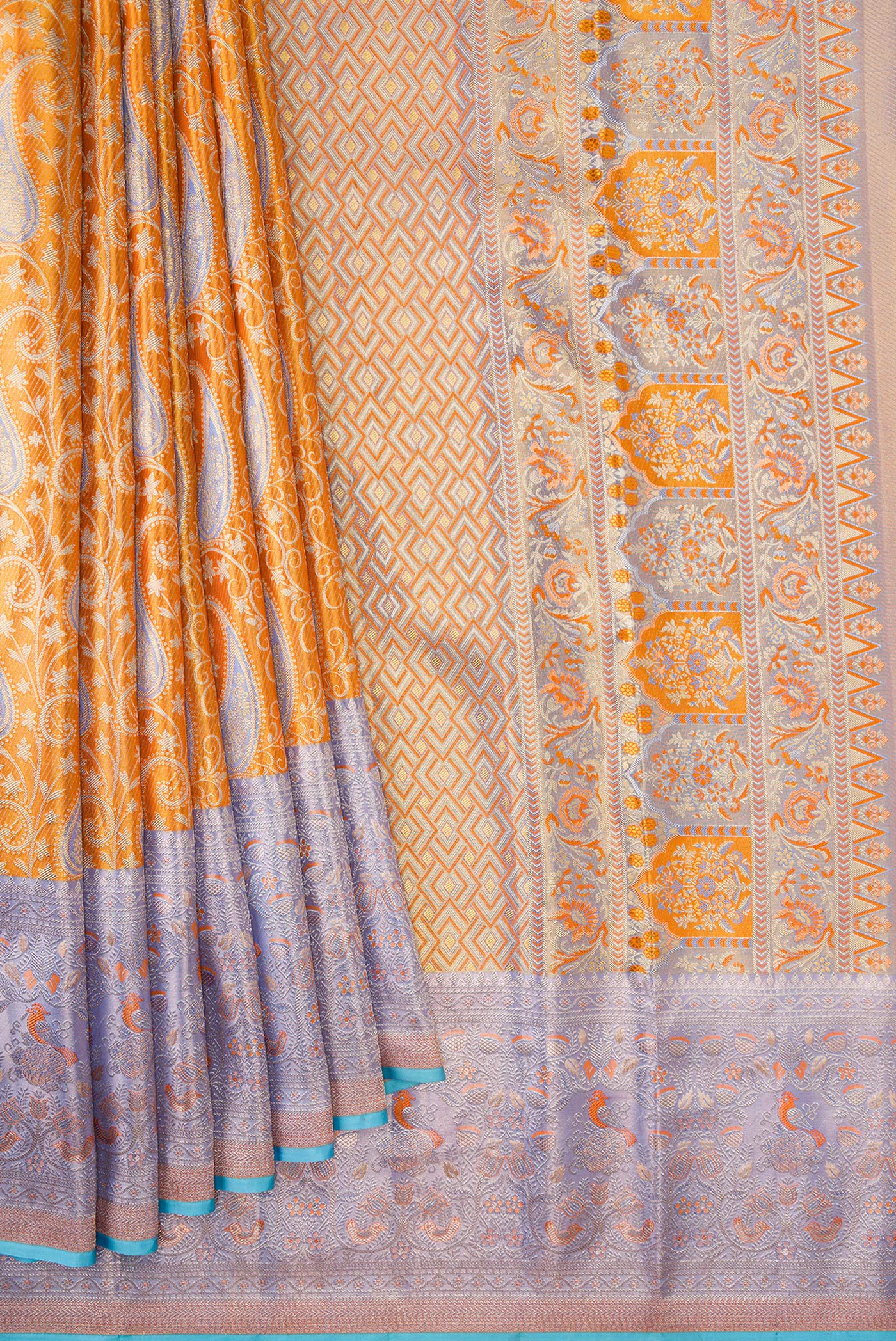 Pleats and pallu of Orange Dual Tone Kanjivaram Tissue Silk Saree with Zari Brocade on the body and Zari Border. 