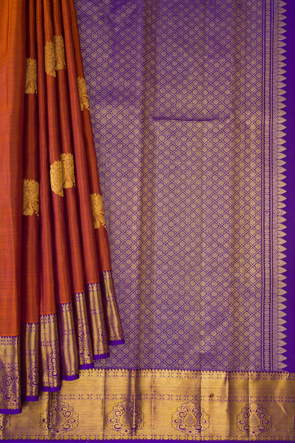 Pleats and pallu of Brown Dual Tone Kanjivaram Silk Saree with Zari Butta on the body and Zari Border. 