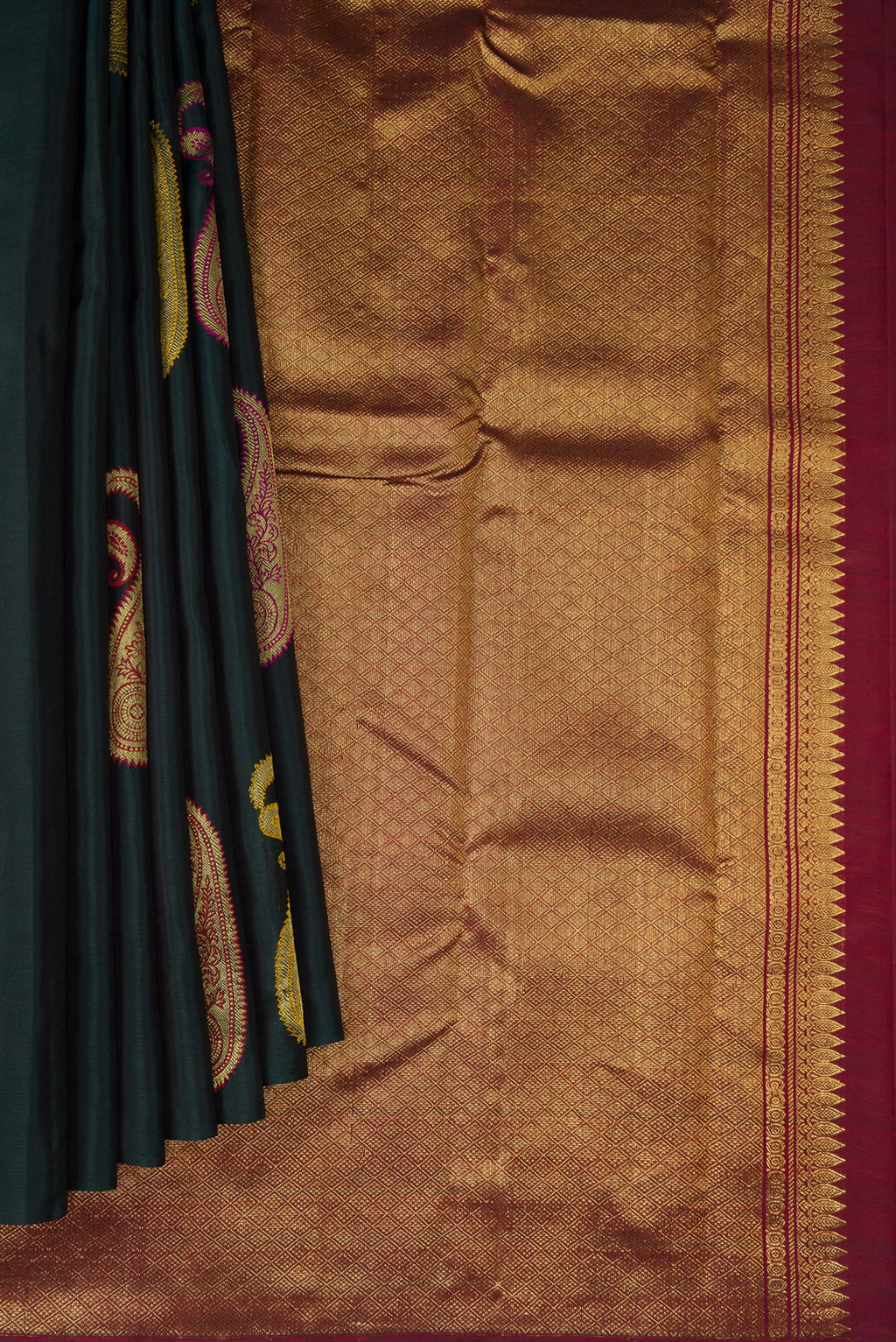 Pleats and pallu of Bottle Green Dual Tone Kanchipuram Silk Saree with Zari And Thread Butta on the body and Without Border. 